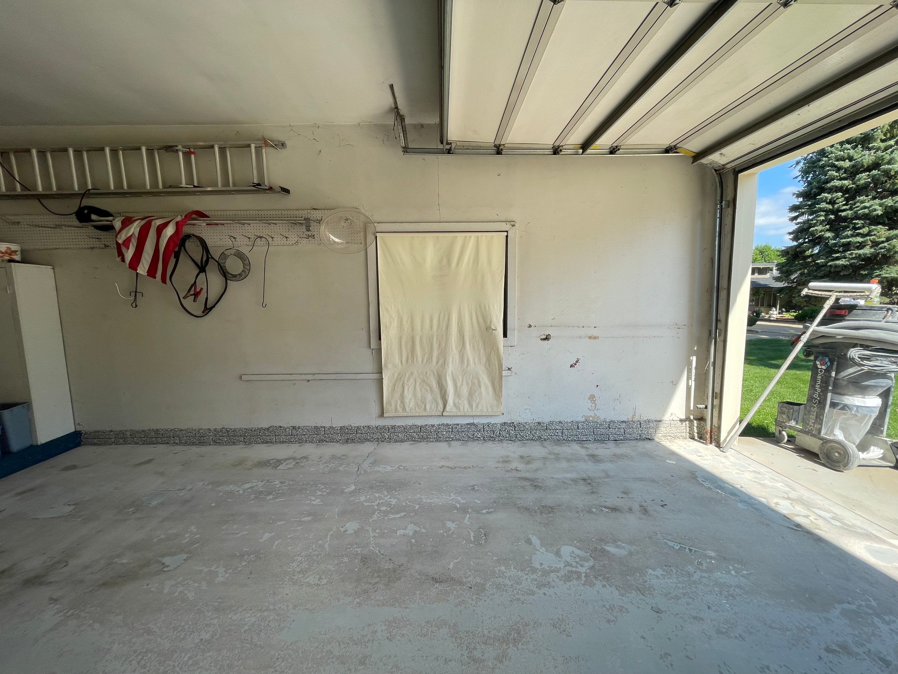 Custom Creekbed Garage Floor Coating in Sioux Falls by Select Painting, Coatings & Garage Cabinets