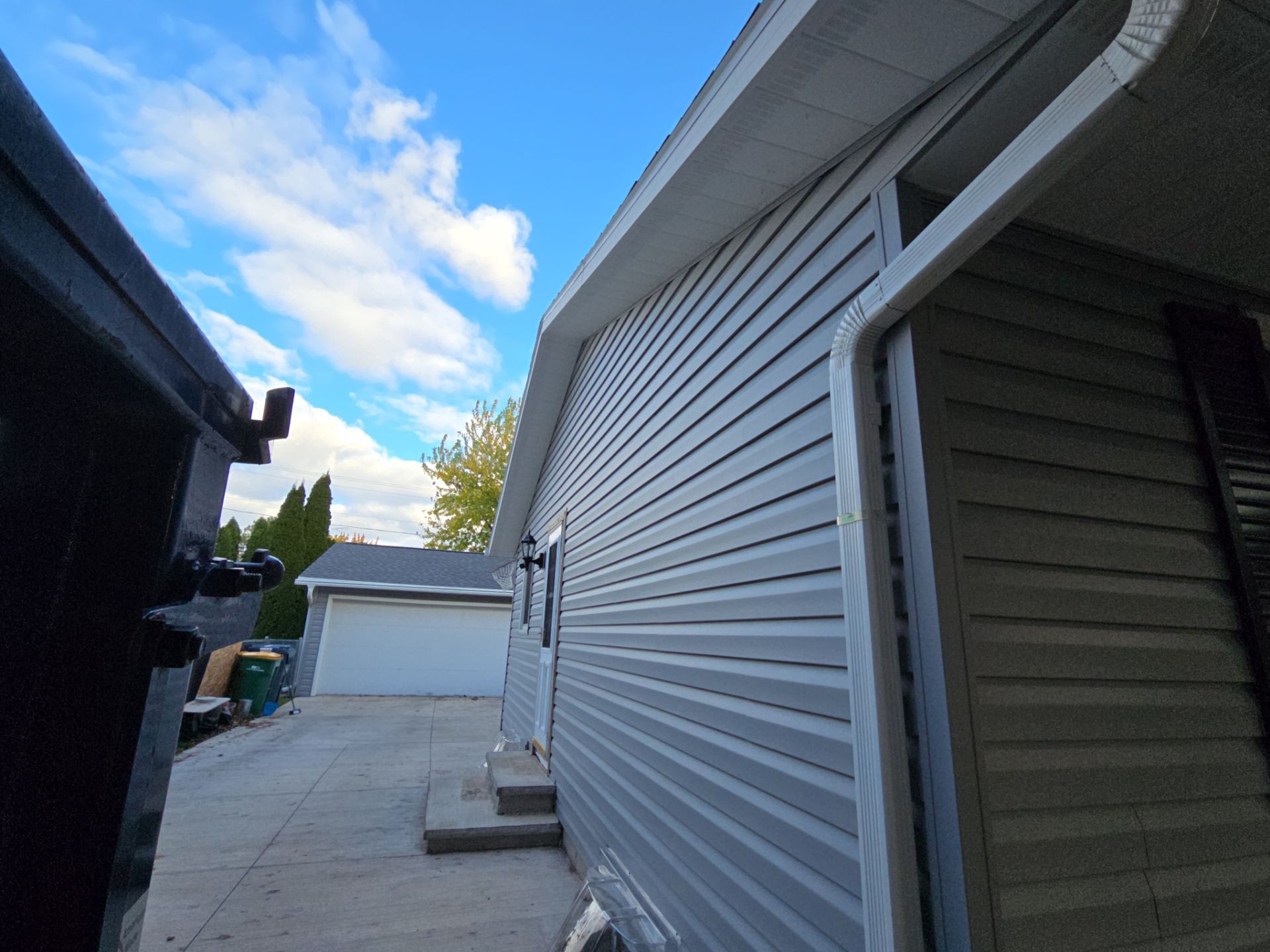 Siding Replacement with Vinyl Siding in Granite Gray by Gellings Roofing & Siding