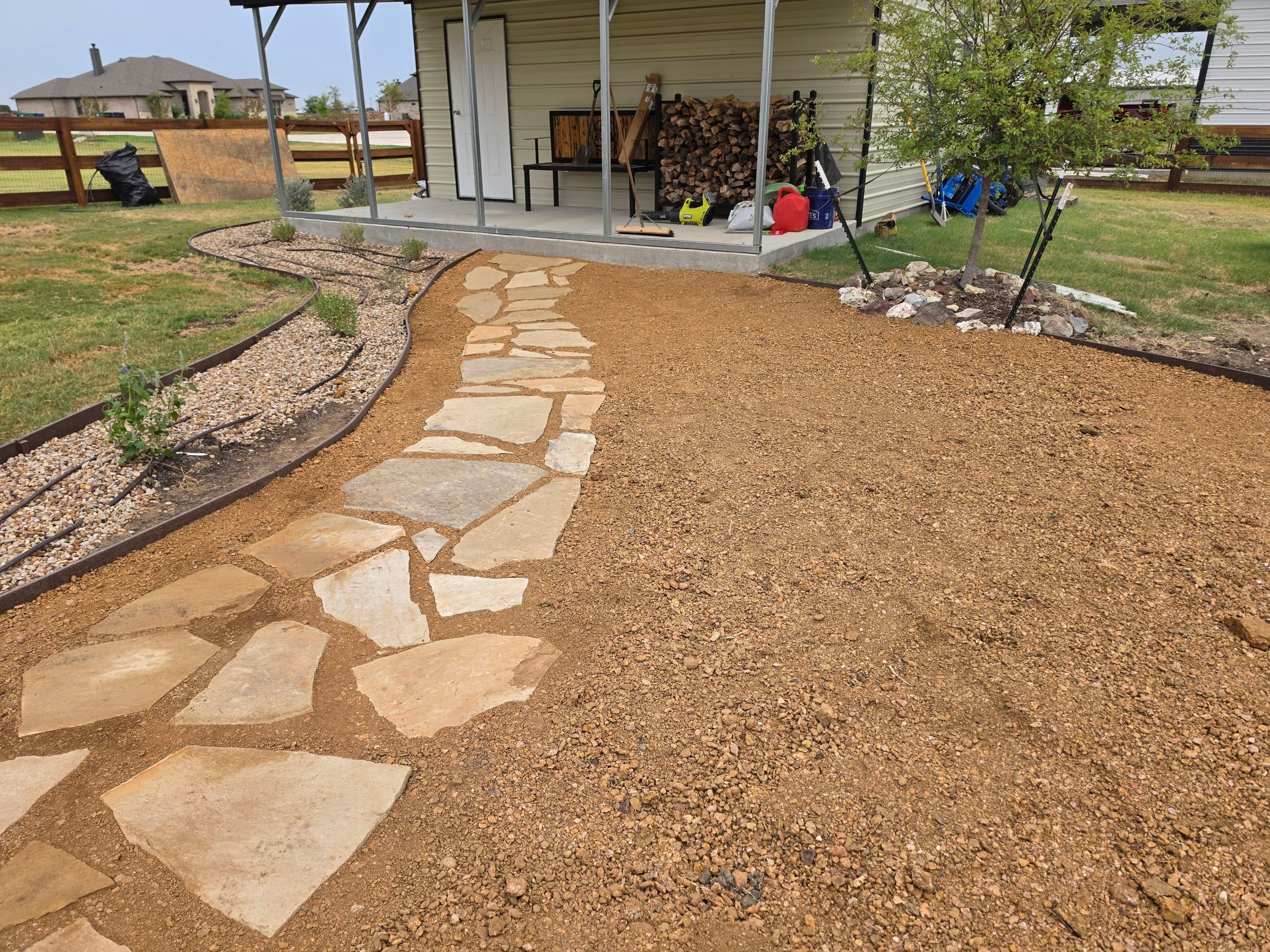 Argyle Residential Landscape Installation with Flagstone Path and Outdoor Seating by Conserva Irrigation NW Dallas