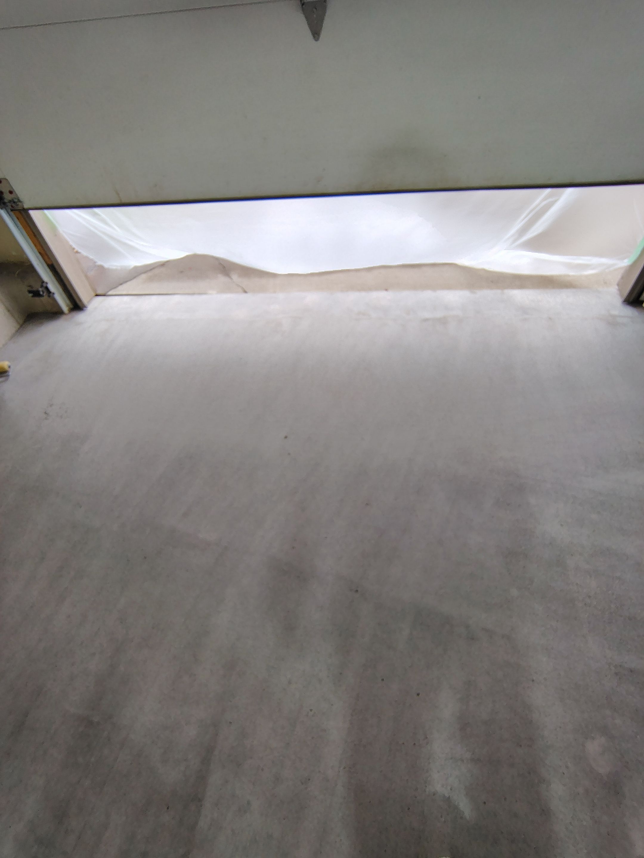 Multi-Car Garage Concrete Coating and Epoxy Finish in Sioux Falls by Select Painting, Coatings & Garage Cabinets