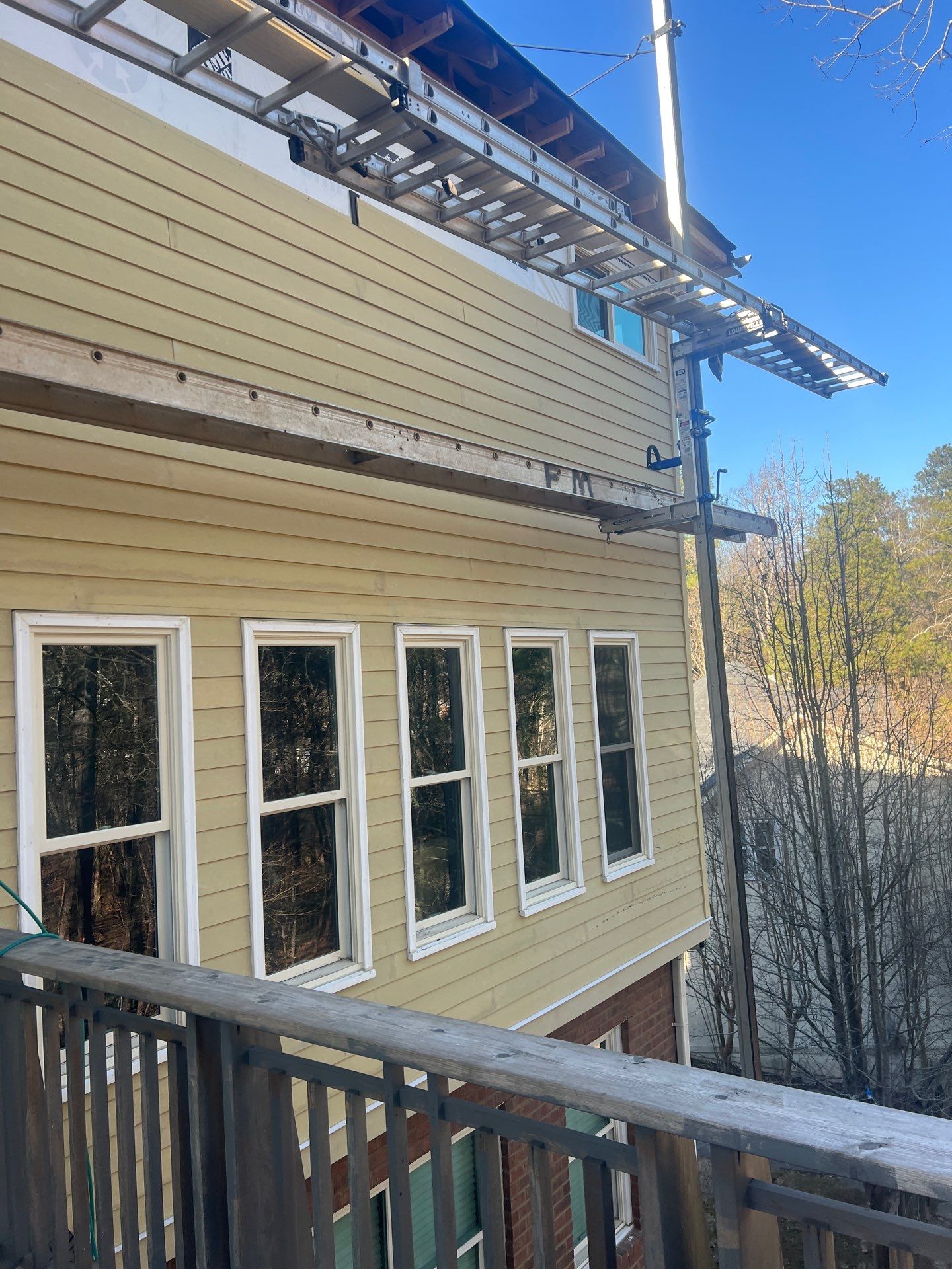 James Hardie Siding Replacement, Exterior Painting, Deck Stain, and Gutter Installation in Peachtree Corners, GA by Nelson Exteriors