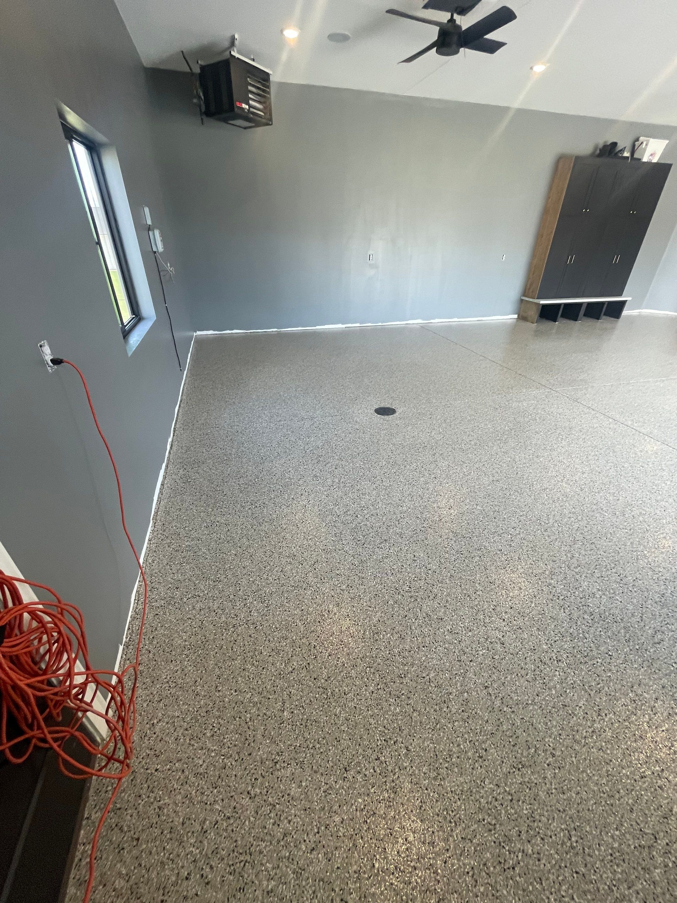 Custom Speckled Concrete Coating for Dell Rapids Garage by Select Painting, Coatings & Garage Cabinets
