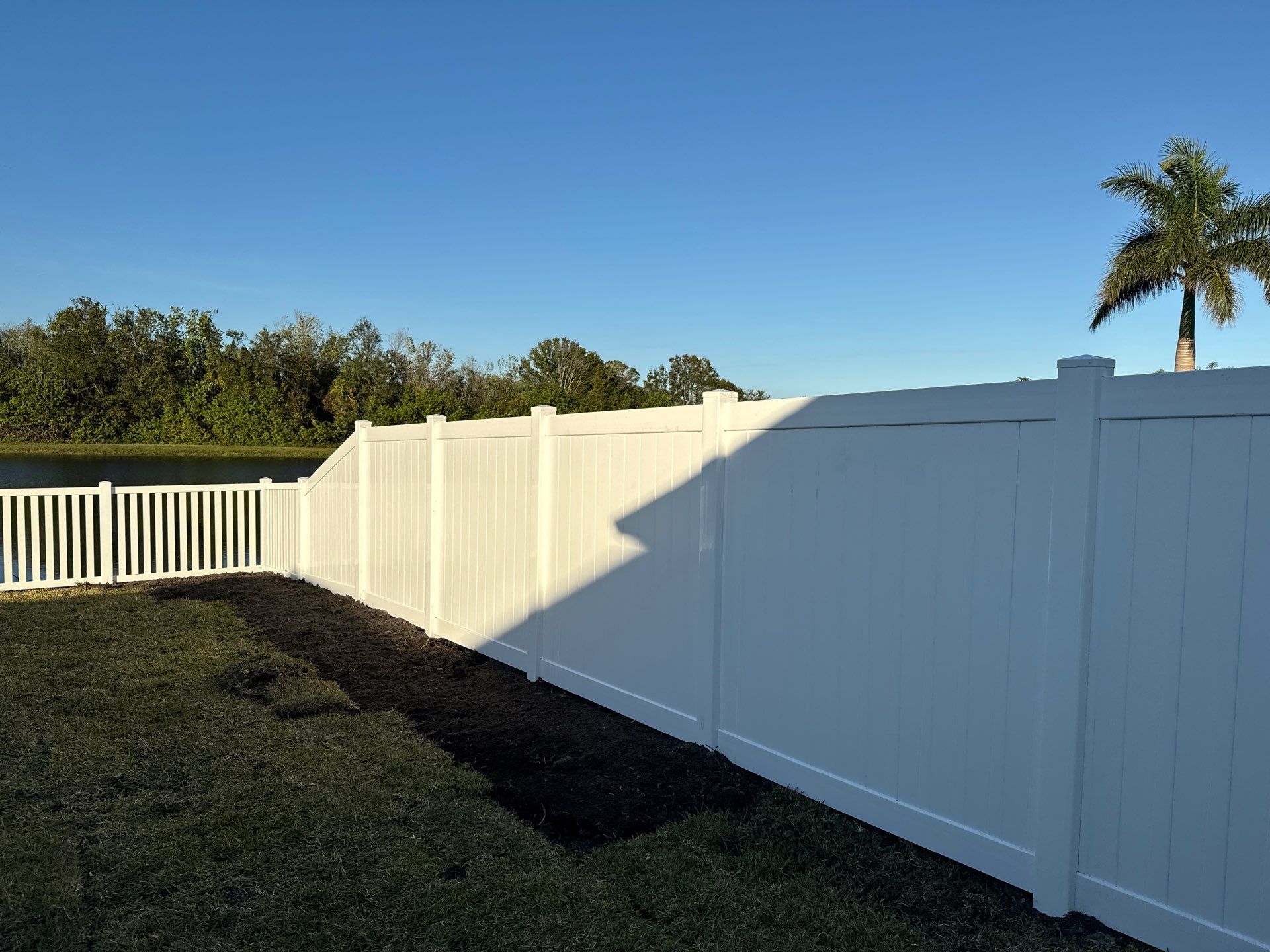 Vinyl Picket Fence Installation using 6Ft White Vinyl Privacy Fence with a 4Ft White Clearwater Picket Fence by Asap fence and gates, LLC