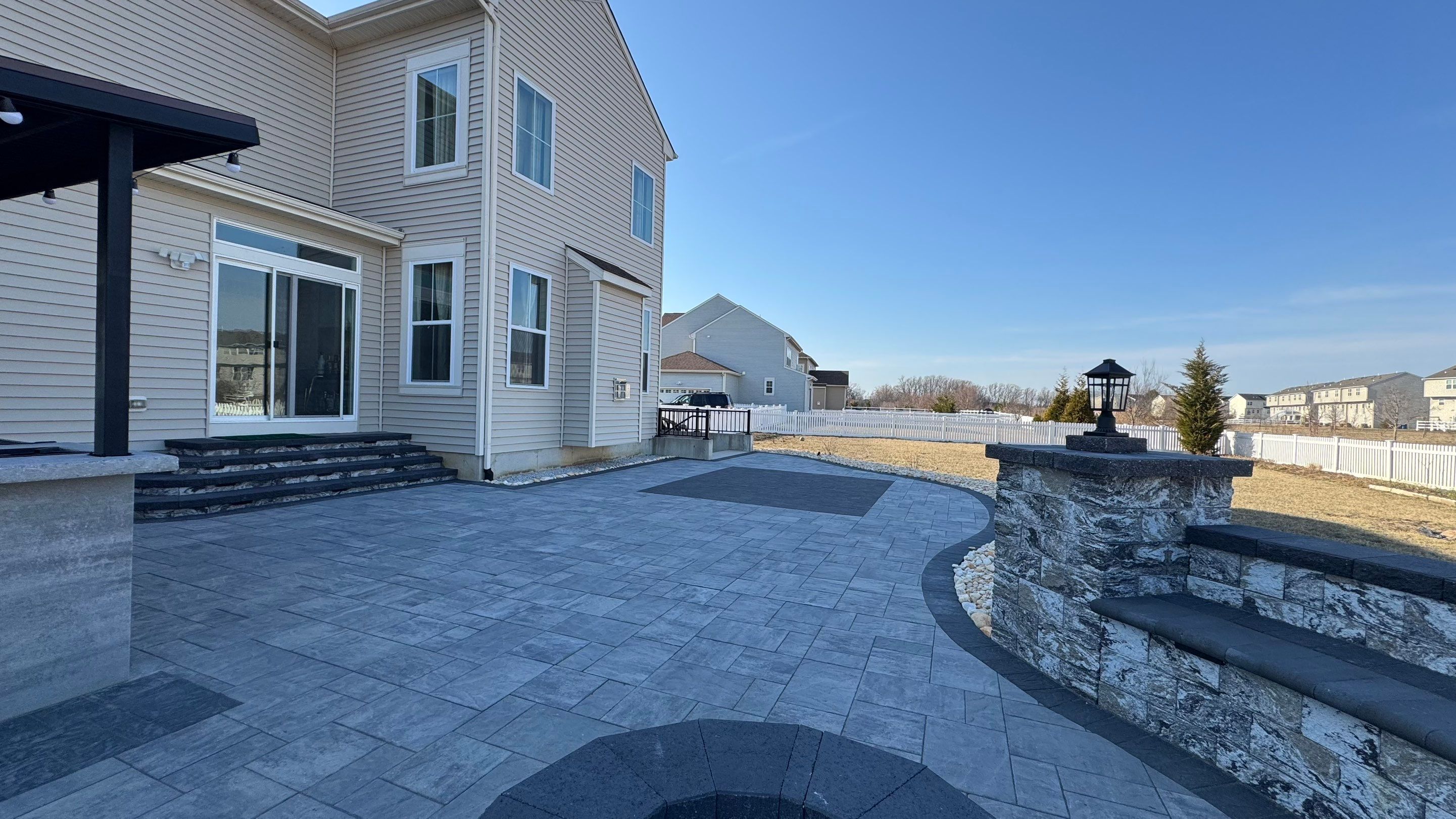 Custom Belgard patio by Studio G Indoor Spaces & Outdoor Living