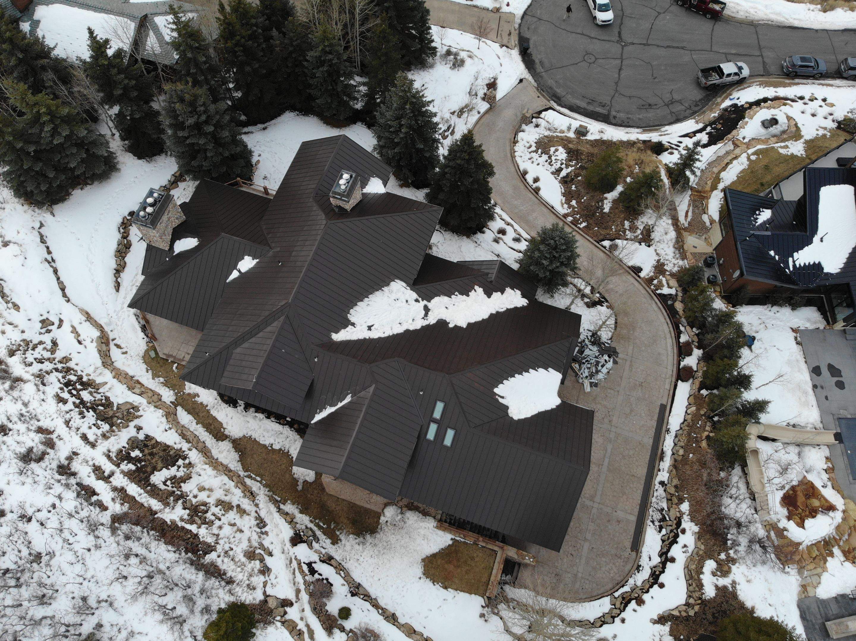 Standing Seam Metal Roof Replacement After Snow Damage by ASAP Roofing & Restoration