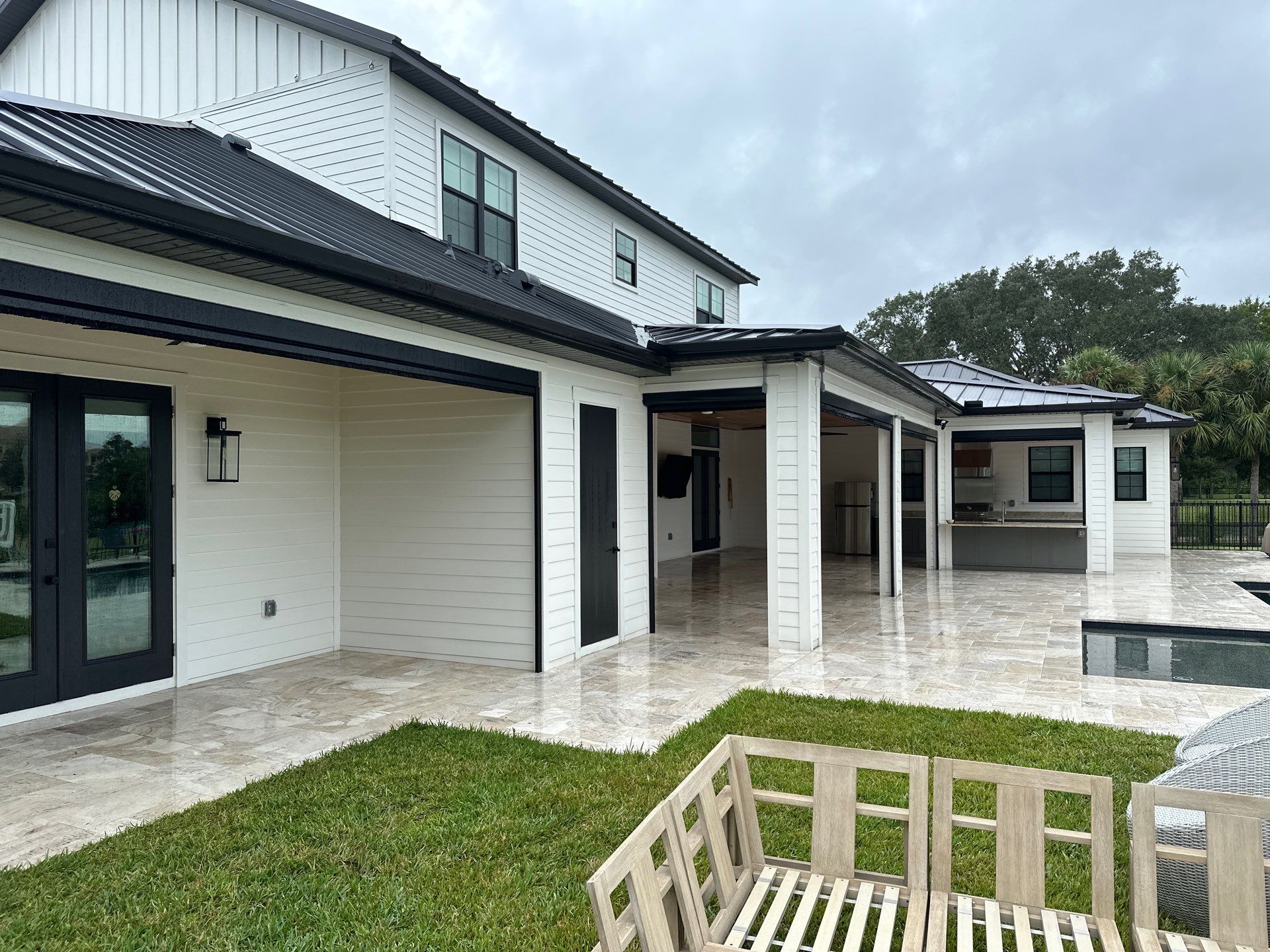 Complete Two-Story House Wash and Driveway Cleaning in Winding River Community, Bradenton, FL by Sunshine AquaWash