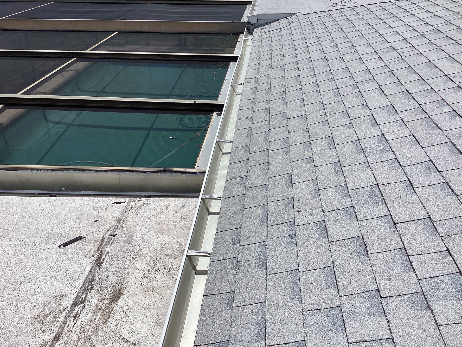 White Seamless Gutters and Splash Guards in Fort Myers FL by Gutter Professor by Gutter Professors