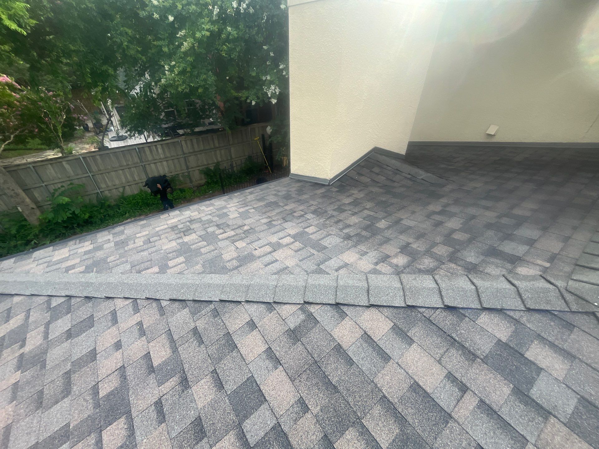 Tan exterior with IKO Driftshake by Tejas Roofworks + Restoration