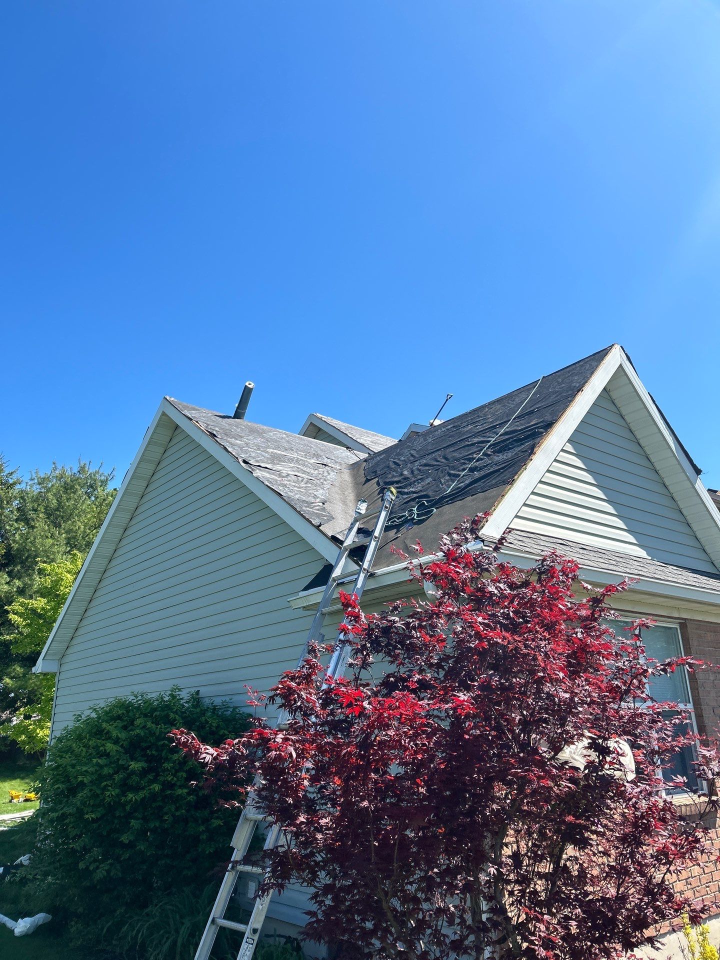 Exterior Installation using Onyx Black Durations and White Siding by WIW Enterprises Inc