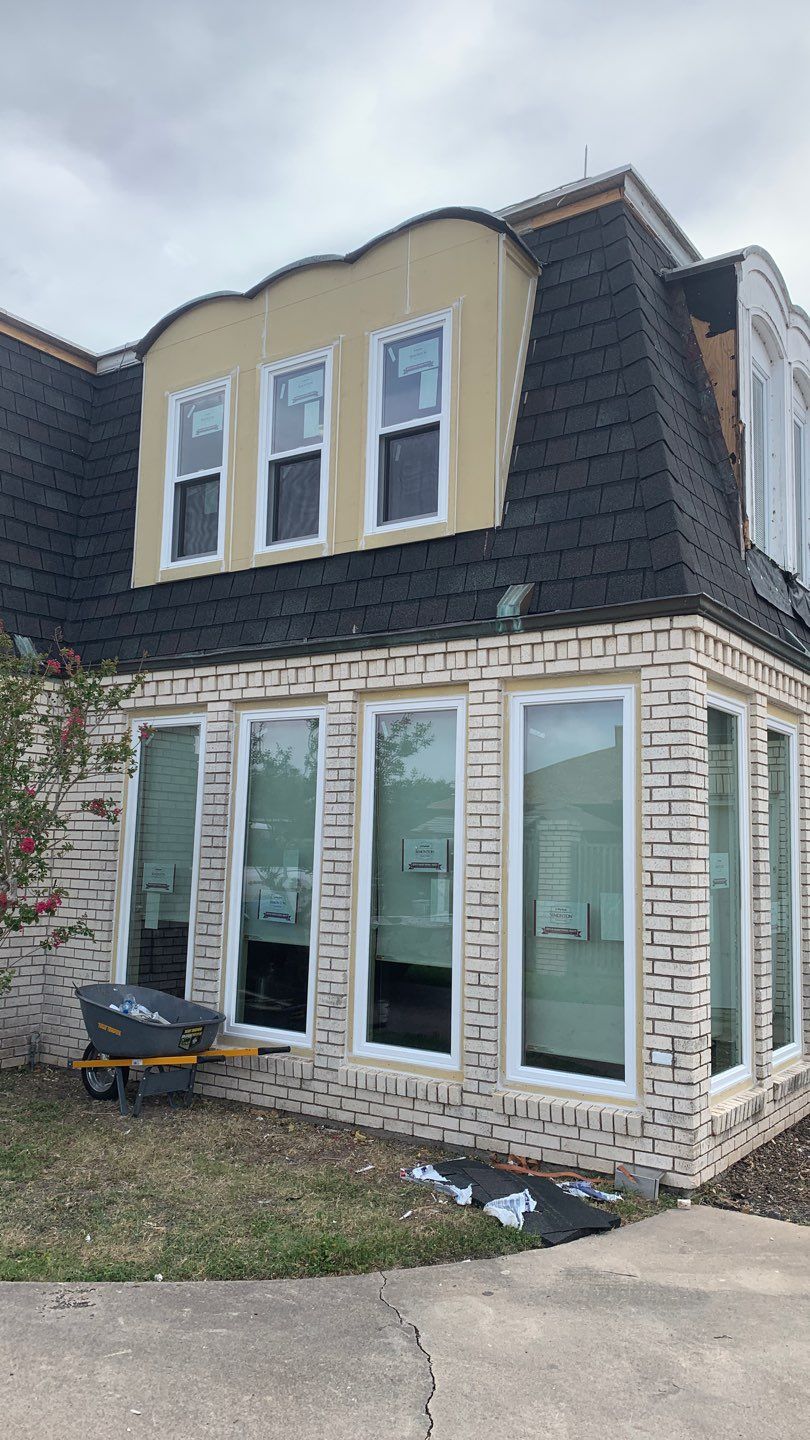 Mansard Charm by Bayfront Roofing and Construction