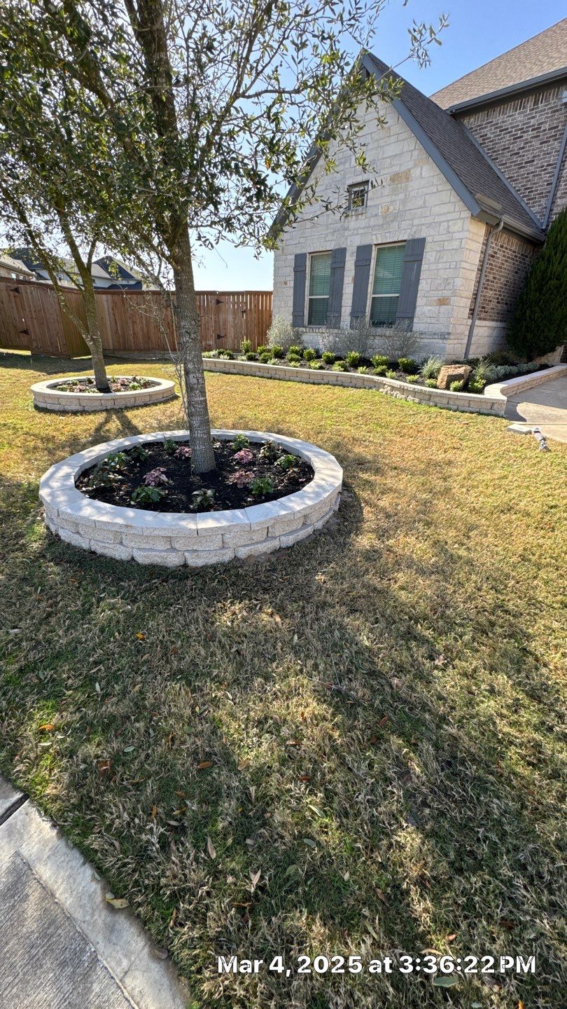 🌿✨ Darlene & Andrew’s Amazing Curb Appeal Transformation  Some projects are more than just landscaping—they’re a conversion of curb appeal from the ground up. For Darlene & Andrew, Alejandro and the Texas Urban Team designed and delivered a complete solution that reshaped their flower beds, solved drainage challenges, and gave new life to the sideyard.  💡 From planning to execution, every step was tailored to build both beauty and functionality:  🌸 Flower Beds, Reinvented  Demolition of old beds, plants, and mulch.  Fresh soil preparation, weed protection, and a brand-new retainer wall built with hand-cut stone and decorative caps.  Carefully selected plants and garden mix to ensure health and visual harmony.  💧 Drainage & Irrigation Upgrades  Outdated corrugated pipes replaced with PVC drainage lines to carry water safely away from the foundation.  New irrigation system combining drip lines and sprinklers—watering plants while keeping the house walls protected.  Sideyard drainage extended with catch basins and PVC piping to prevent water pooling and foundation stress.  🚶 Functional Sideyard with Walkway & Trash Area  Graded and leveled sideyard to manage runoff.  Installed a modern gravel and paver walkway for easy access.  Built a firm and tidy concrete-paver pad for trash containers—making the space both practical and polished.  🛠️ Stonework & Craftsmanship  Every stone in the retainer wall was cut, set, and secured by the team of handcrafters, ensuring a durable build that doubles as a design statement.  ✅ Outcome: Darlene & Andrew’s property now has better drainage, a clean and organized sideyard, and elegant new flower beds—all designed for long-term durability and lasting beauty.  📢 Before hiring anyone, review our portfolio. Our work speaks louder than words—each project is a blend of function, protection, and design crafted to last. by Texas Urban Elements
