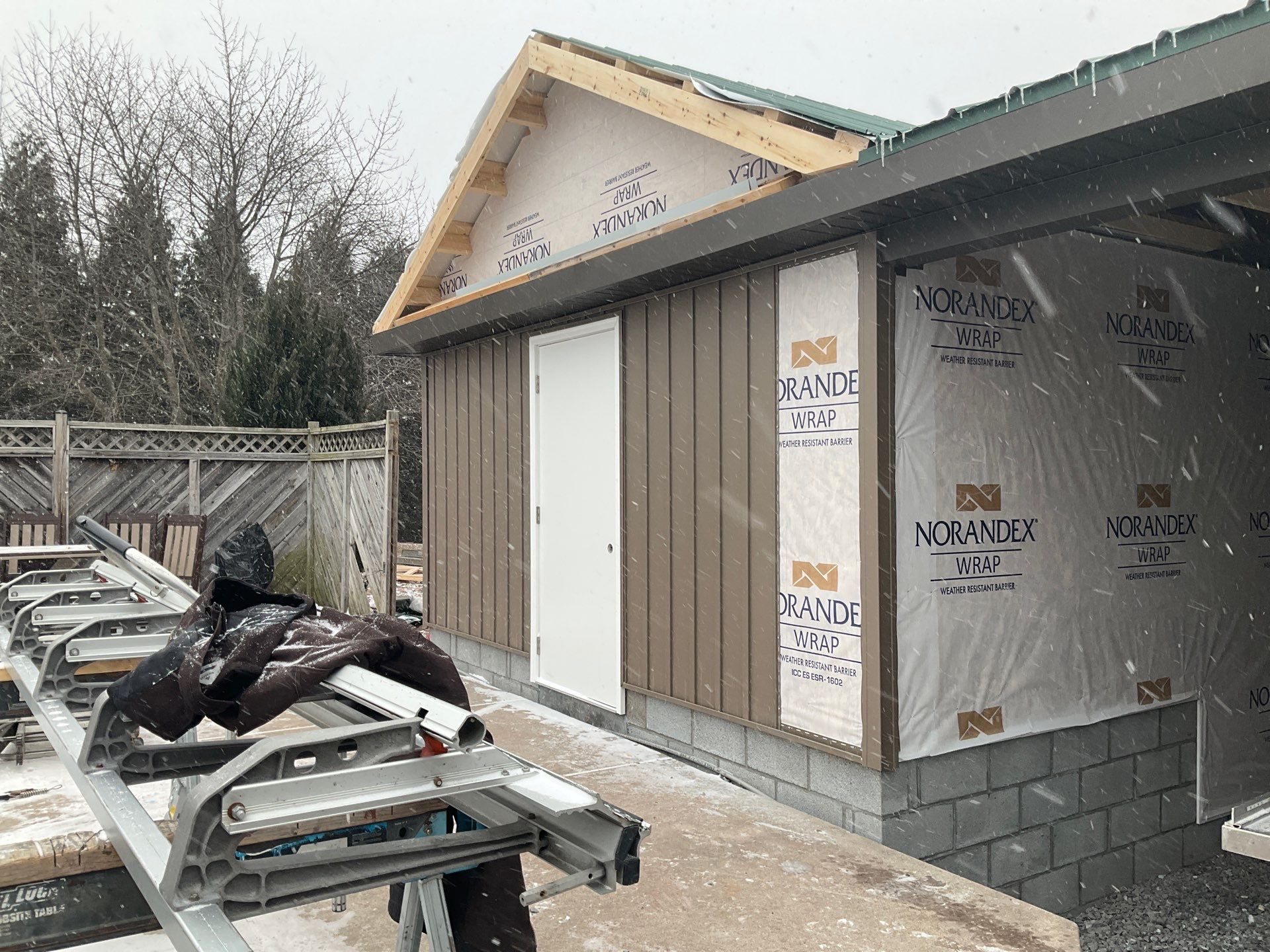 Multi-Story Residential Addition Featuring Textured Metal Siding in Millersburg by Esh Builders