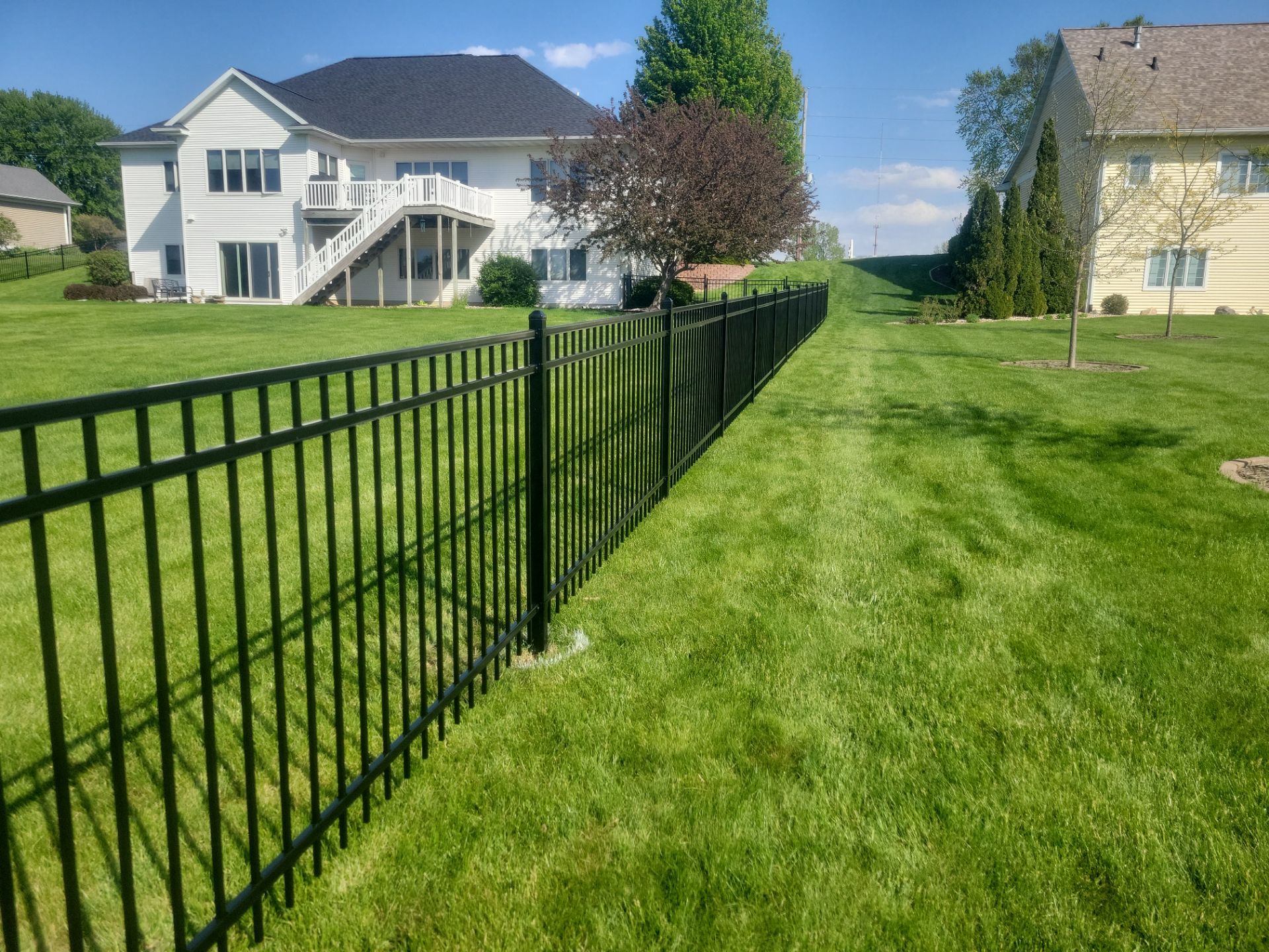 Black Ornamental Metal Picket Fence Installation in Waterloo by Perfect Picket Fence and Stain