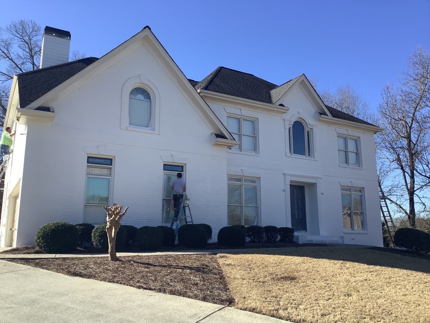 White Brick Exterior Painting and Deck Refinishing in Duluth by Swift Home Renovations