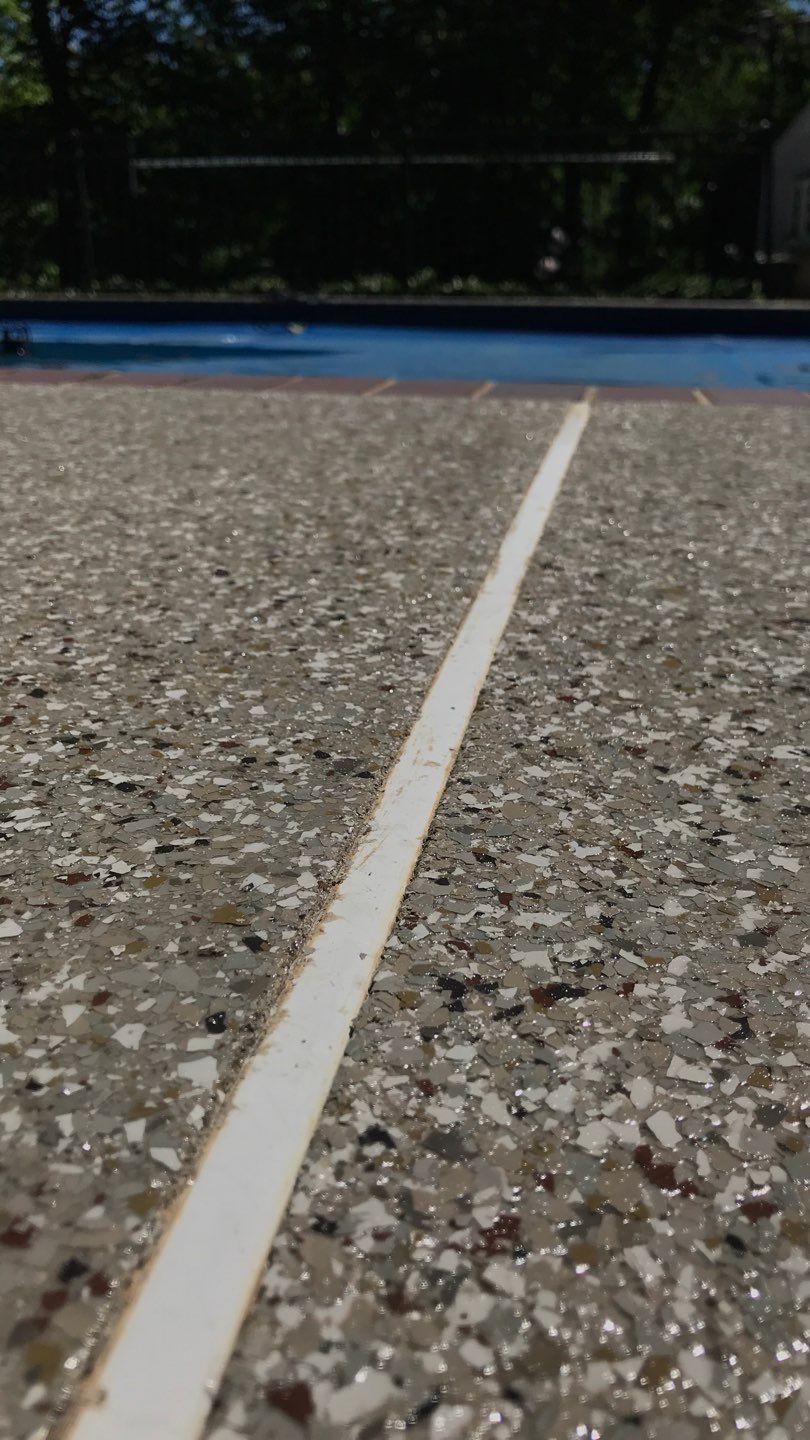 Pool Deck using Pebble Beach by Select Painting, Coatings & Garage Cabinets