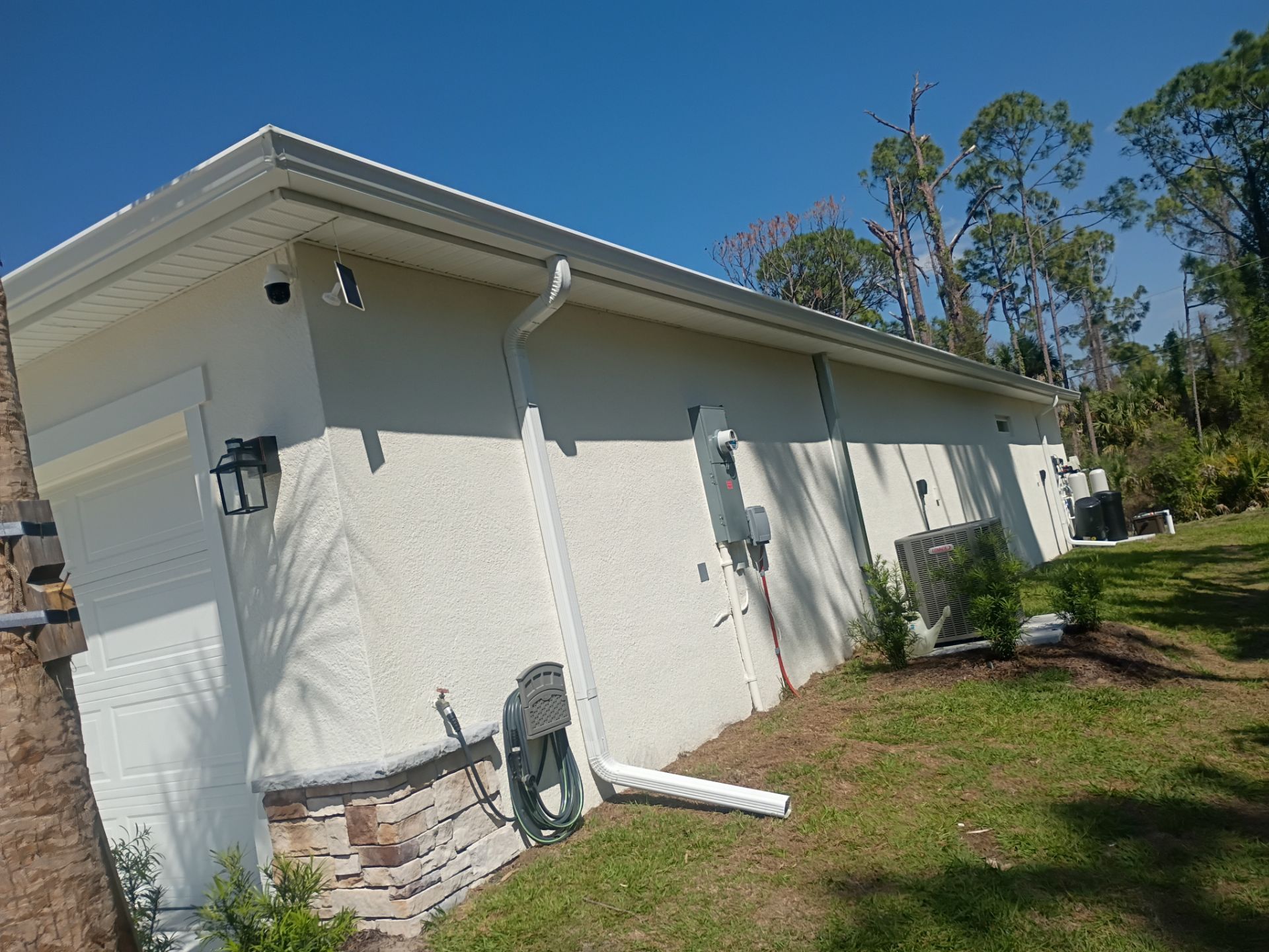 6-inch K-style White Seamless Gutters with Downspouts in North Port, FL by Gutter Professors