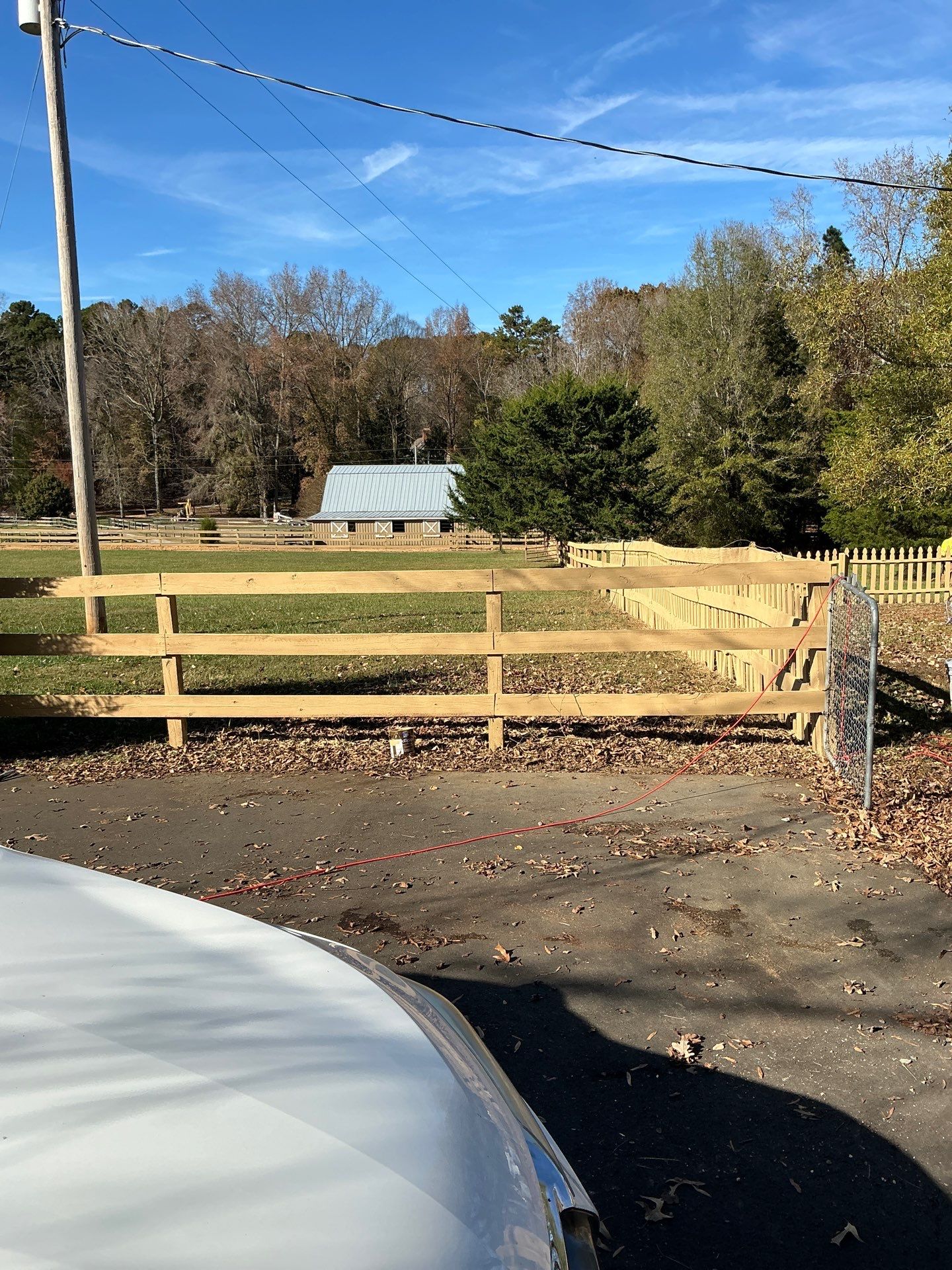 Fence Staining (Farm in Durham NC) by GonzalezPainters & Contractors Inc 