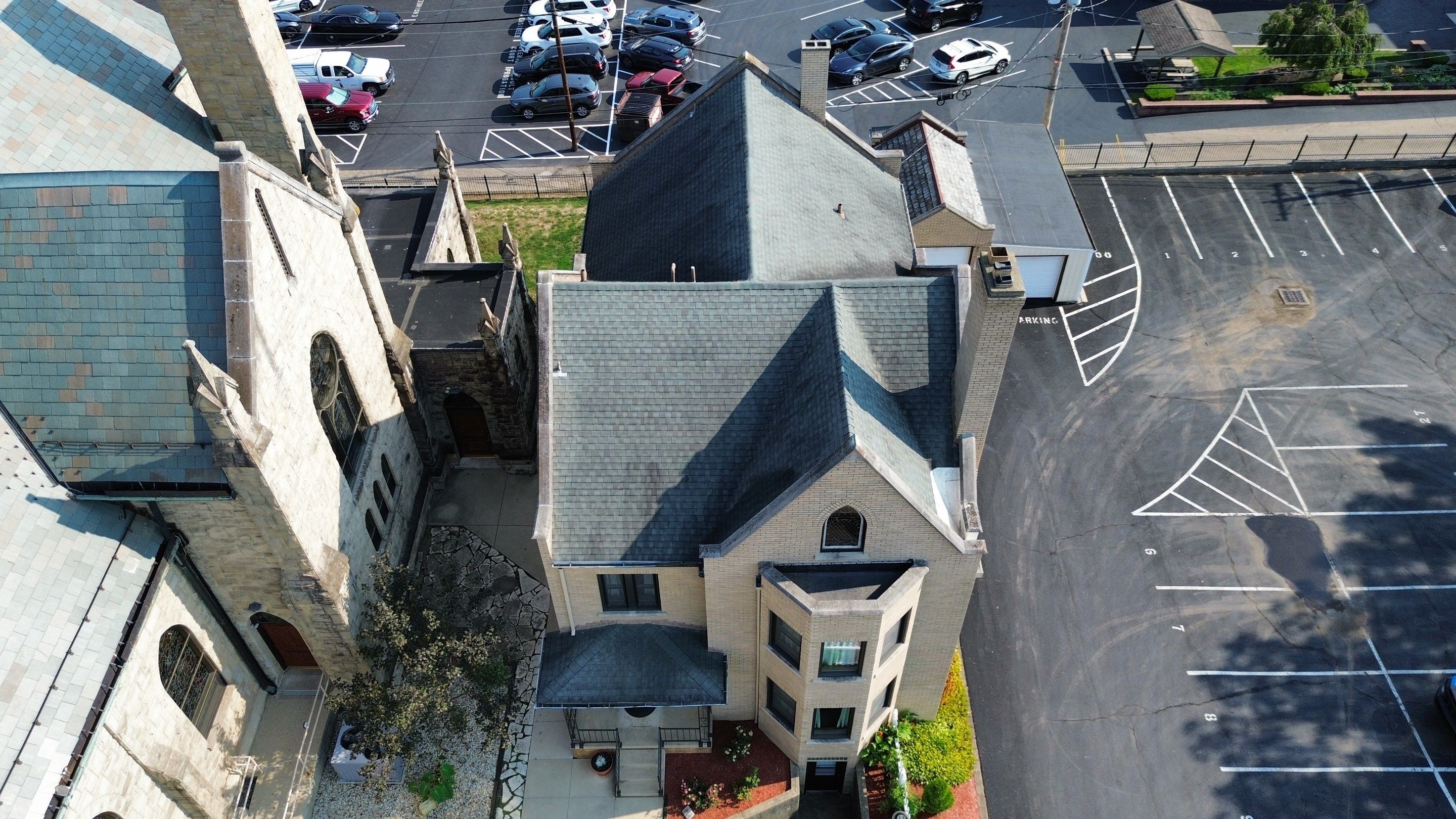 Commercial Roofing Installation using Standing Seam Metal - Frost Black by RoofX 