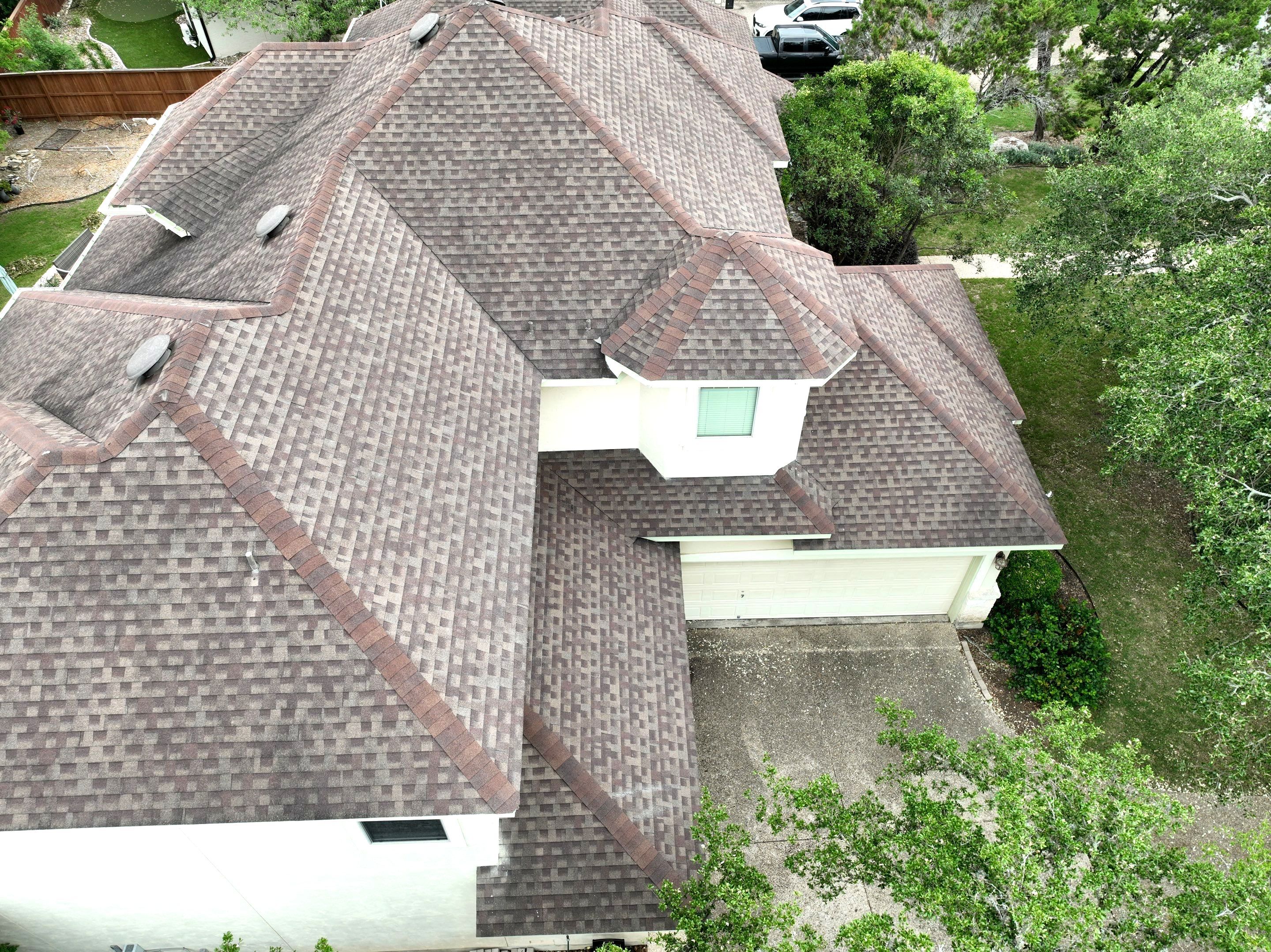 Residential Roof Replacement using 30 Year Laminate Shingles with High Profile Ridge by Premier Roofing and Contracting