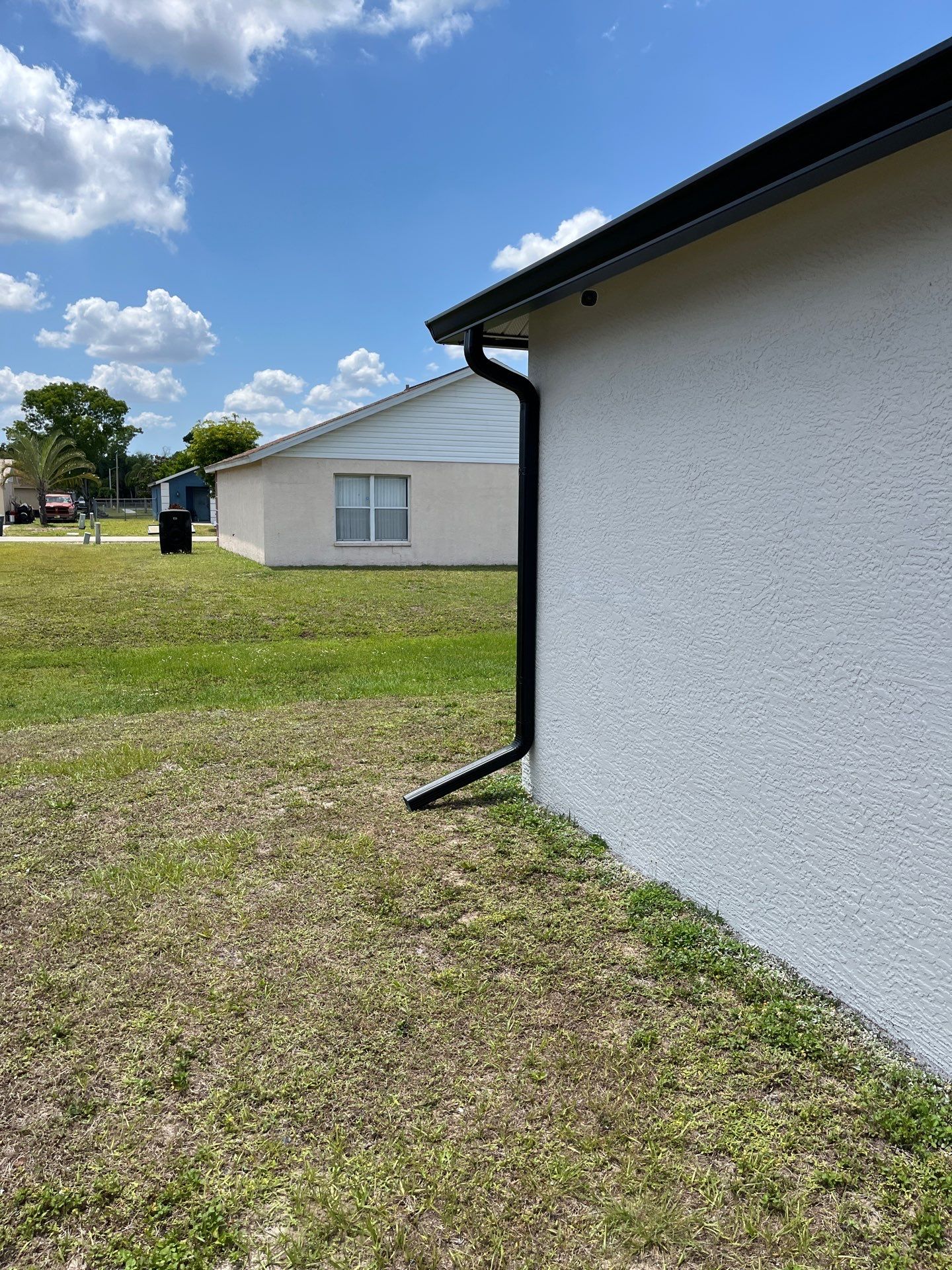 Black Seamless Gutters and Downspouts in Fort Myers FL by Gutter Professors