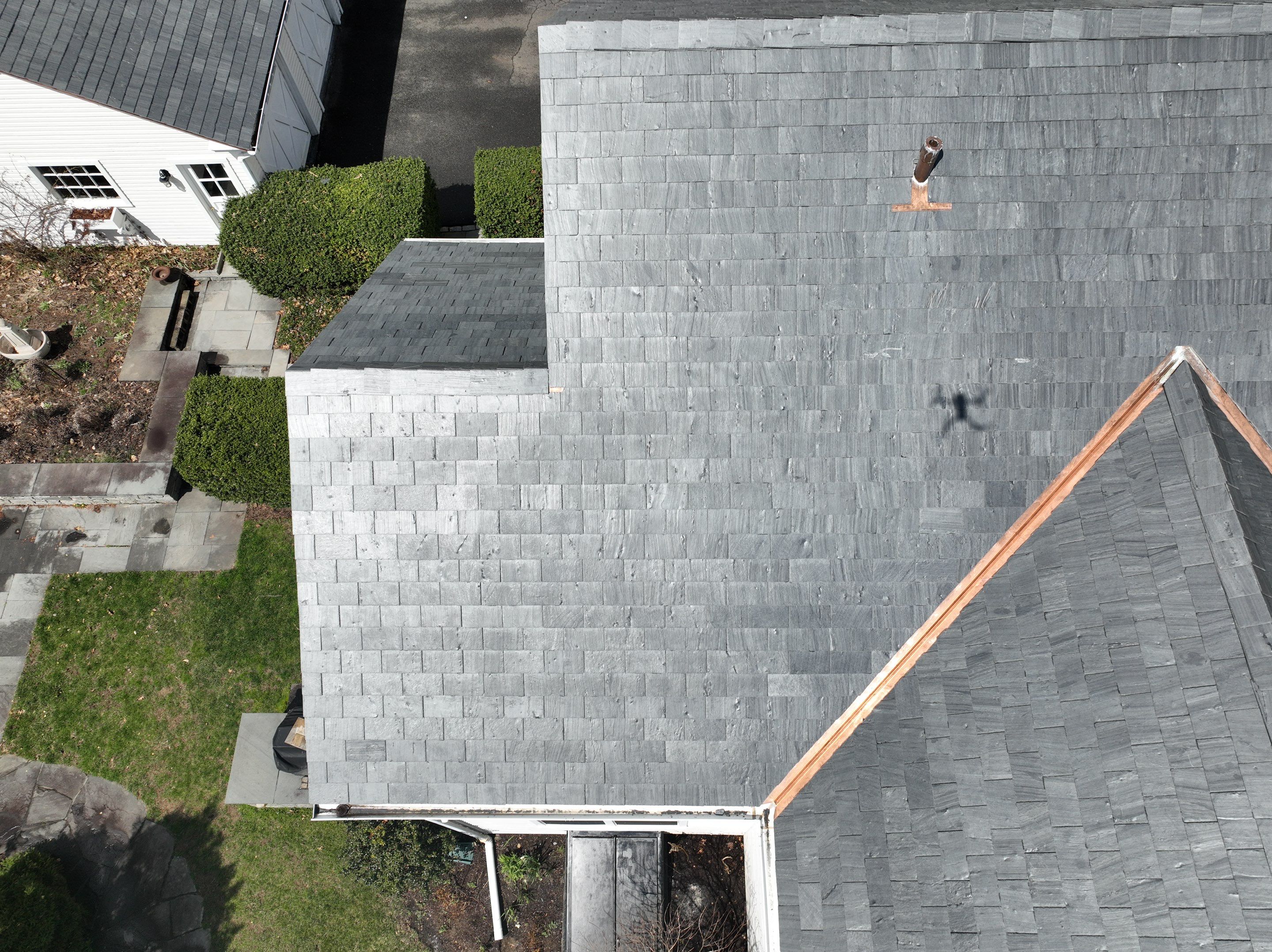 Residential Roofing Installation using Vermont Slate by A Plus Exterior