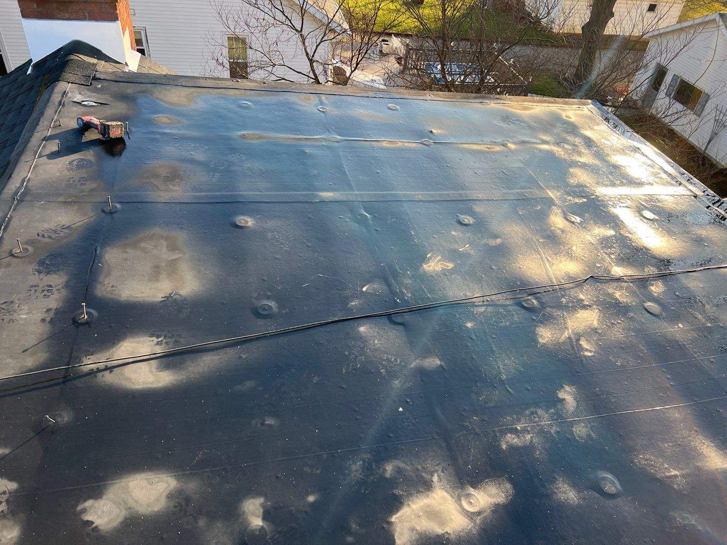 Residential Roofing Installation using 60 mil rubber roof by Nitro Roofing and Construction