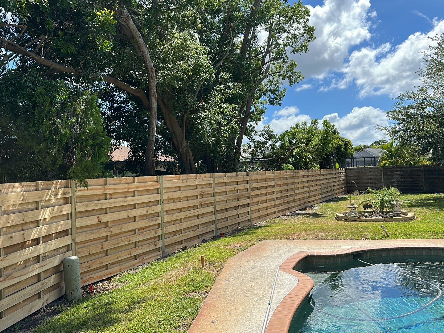 Wood Fence Installation using Horizontal Shadowbox Wood Privacy Fence by Asap fence and gates, LLC