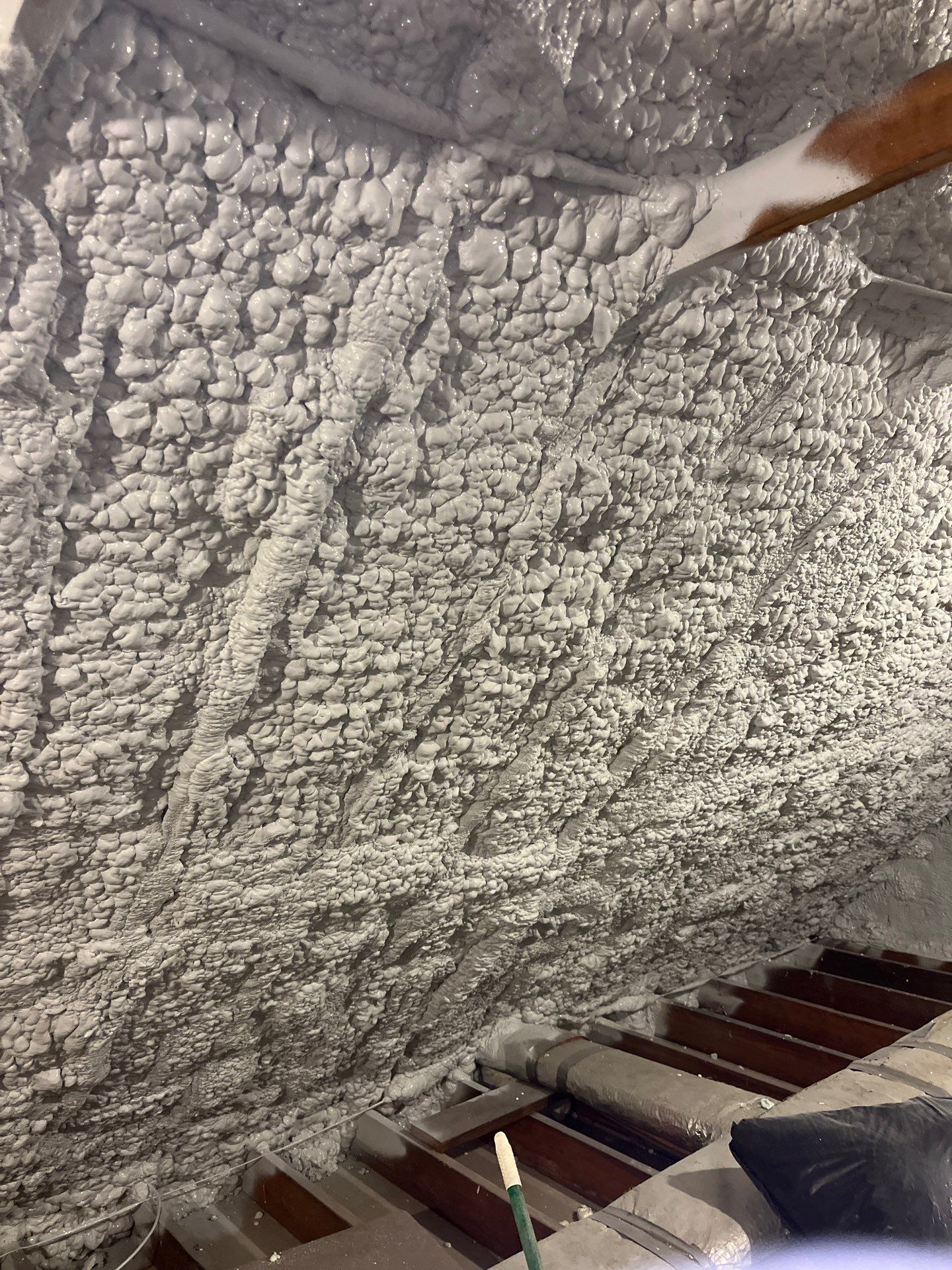 Attic Retrofit using open cell spray foam by NYS Foam & Energy