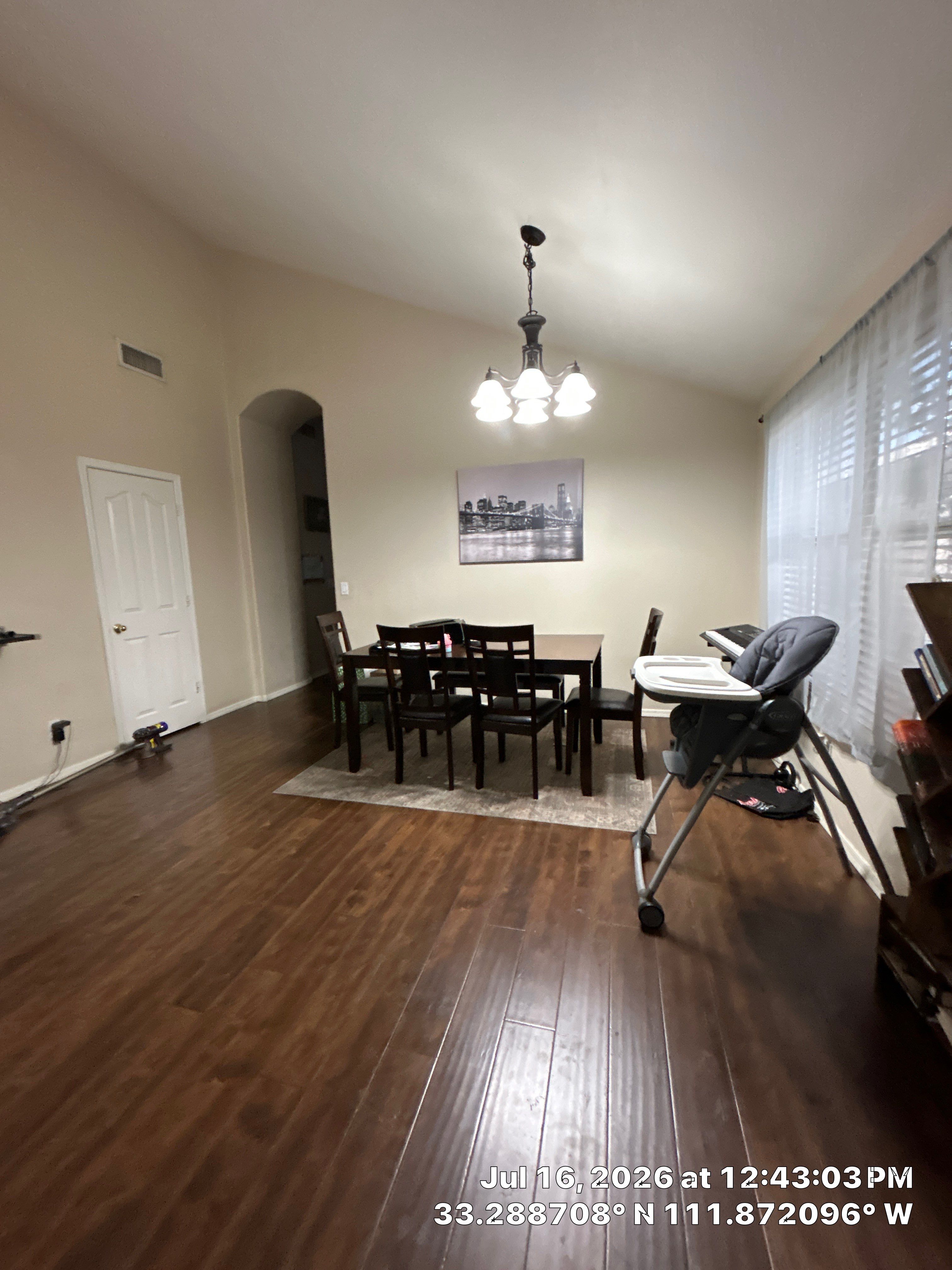 Dark Wood Laminate Flooring Installation for Chandler Dining Room by CompanyCam Sales Demo