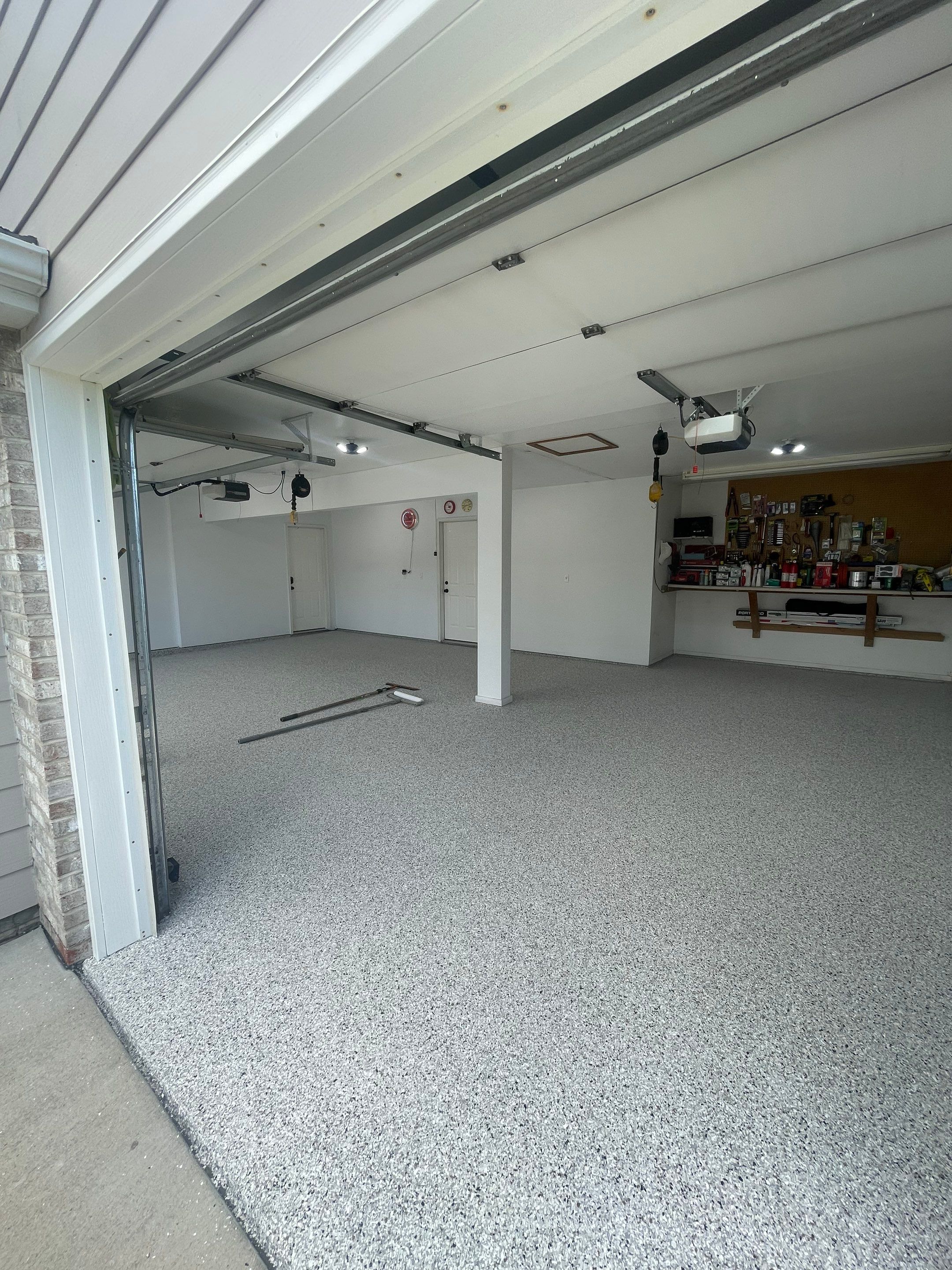 Multi-Car Garage Concrete Coating with Coyote Flake Finish in Sioux Falls by Select Painting, Coatings & Garage Cabinets