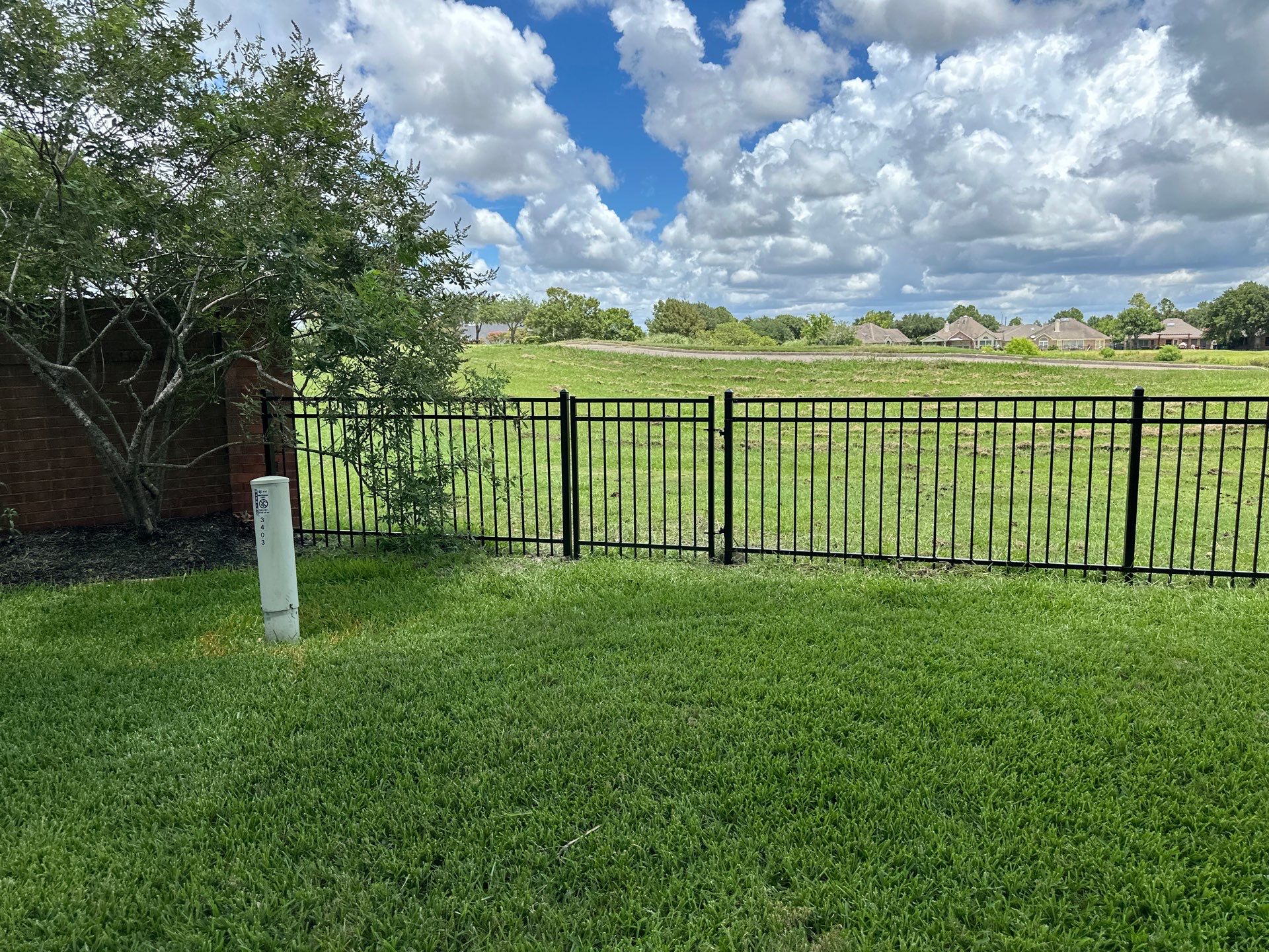 Stunning iron installation in Pearland by Tim's Fences