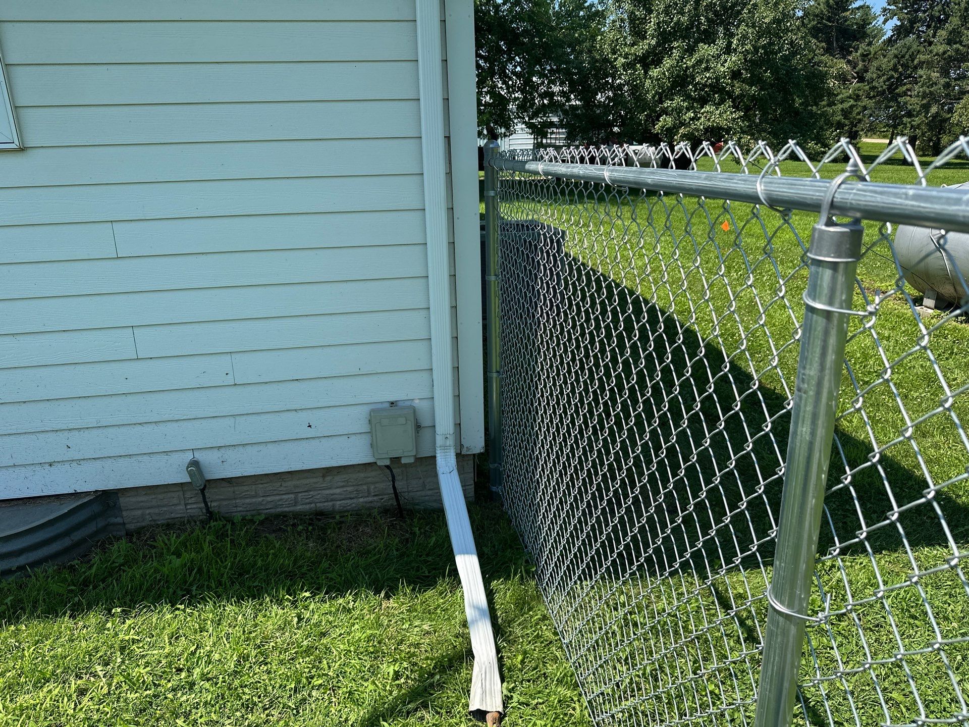 Residential Galvanized Chain Link Perimeter Fence Installation in New Hartford by Perfect Picket Fence and Stain