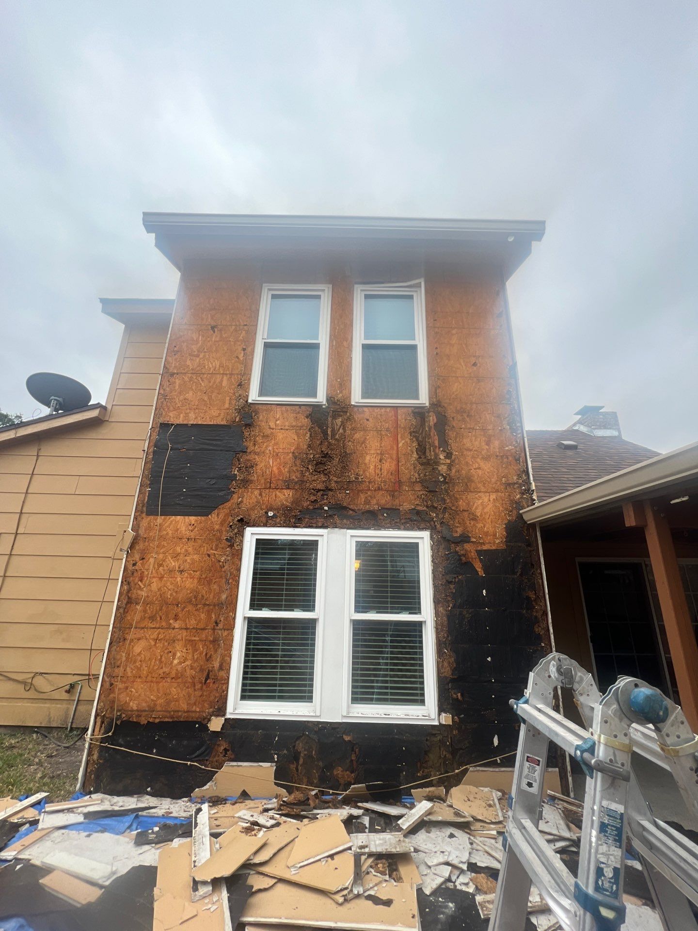 Installing Windows on a Submarine  by Bayfront Roofing and Construction