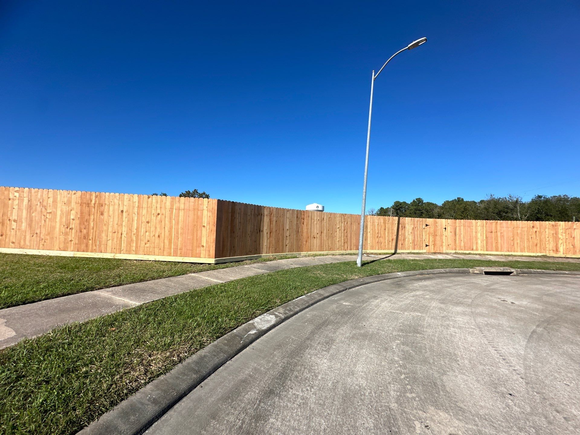 Premium Commercial Fence Installation with Western Red Cedar Pickets, 3 Rails, and Deluxe Wood Gates" by Tim's Fences