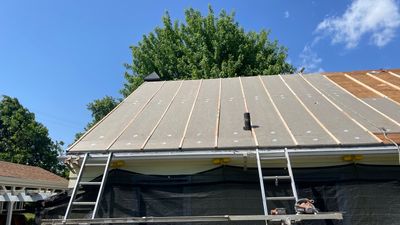Residential Roof Installation with Added Insulation Barrier using Malarkey Vista AR Shingles (Color: Storm Grey)