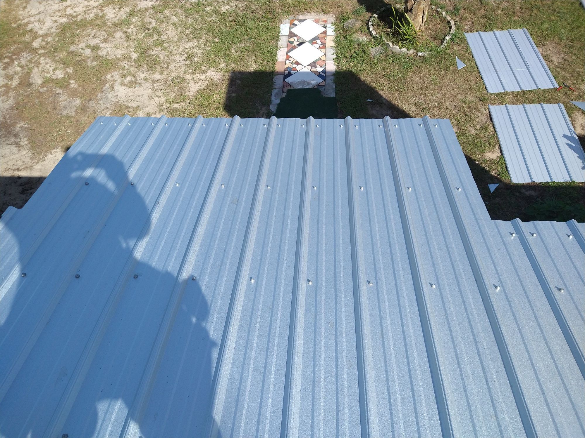Residential Roofing Installation using 26 GA Rib Panel Galvalume by 1st Class Roofing, Inc.