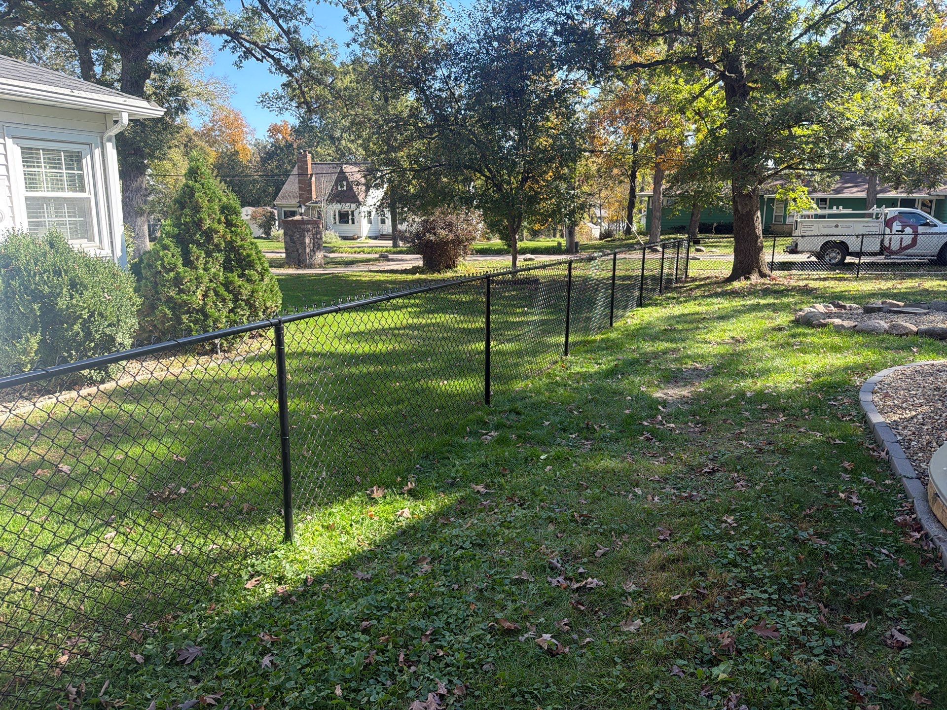 Residential Black Chain Link Fencing in Cedar Falls by Perfect Picket Fence and Stain