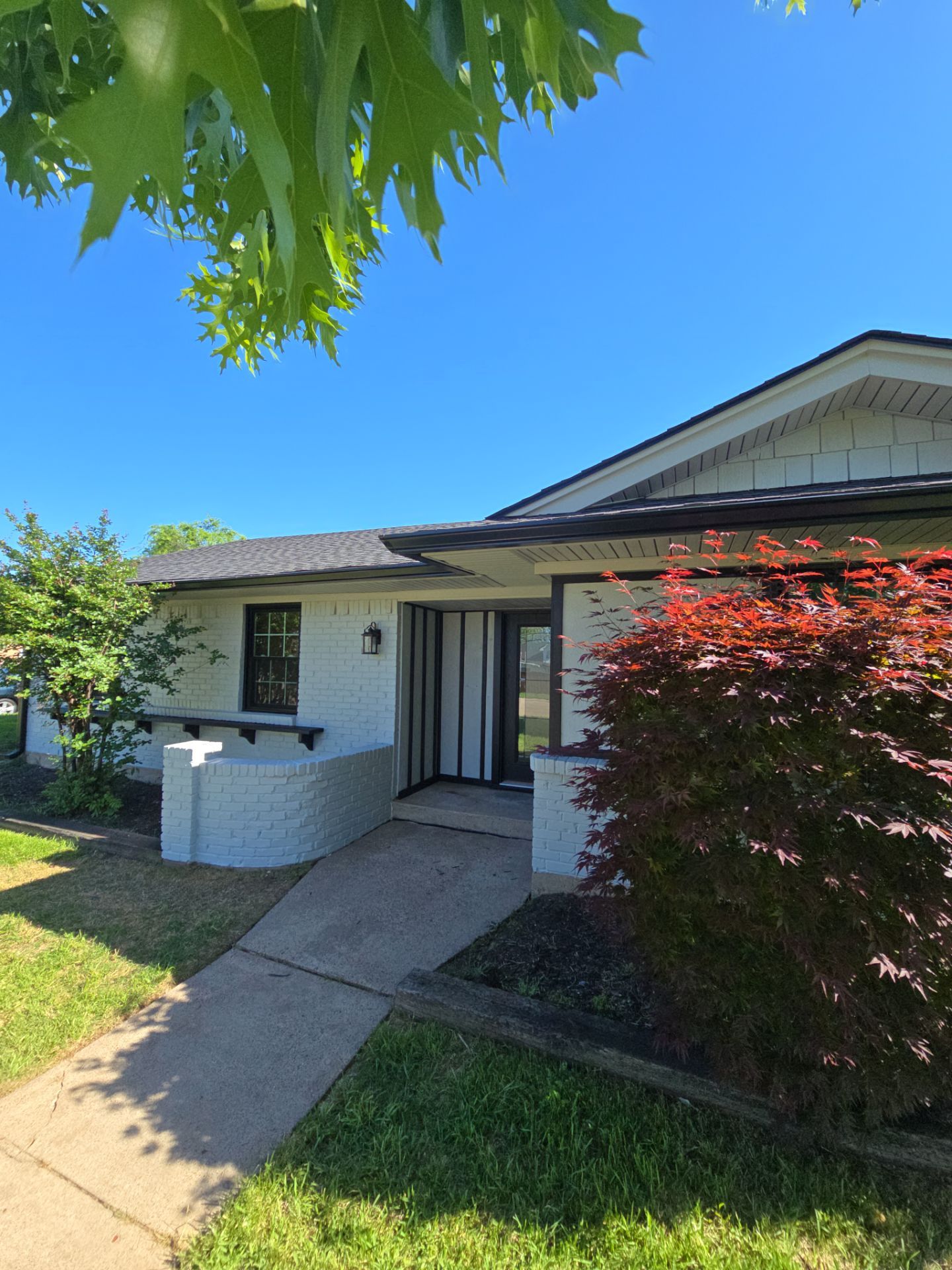 Exterior Home Paint Project with Different Surfaces by SLM General Contractors & Roofing