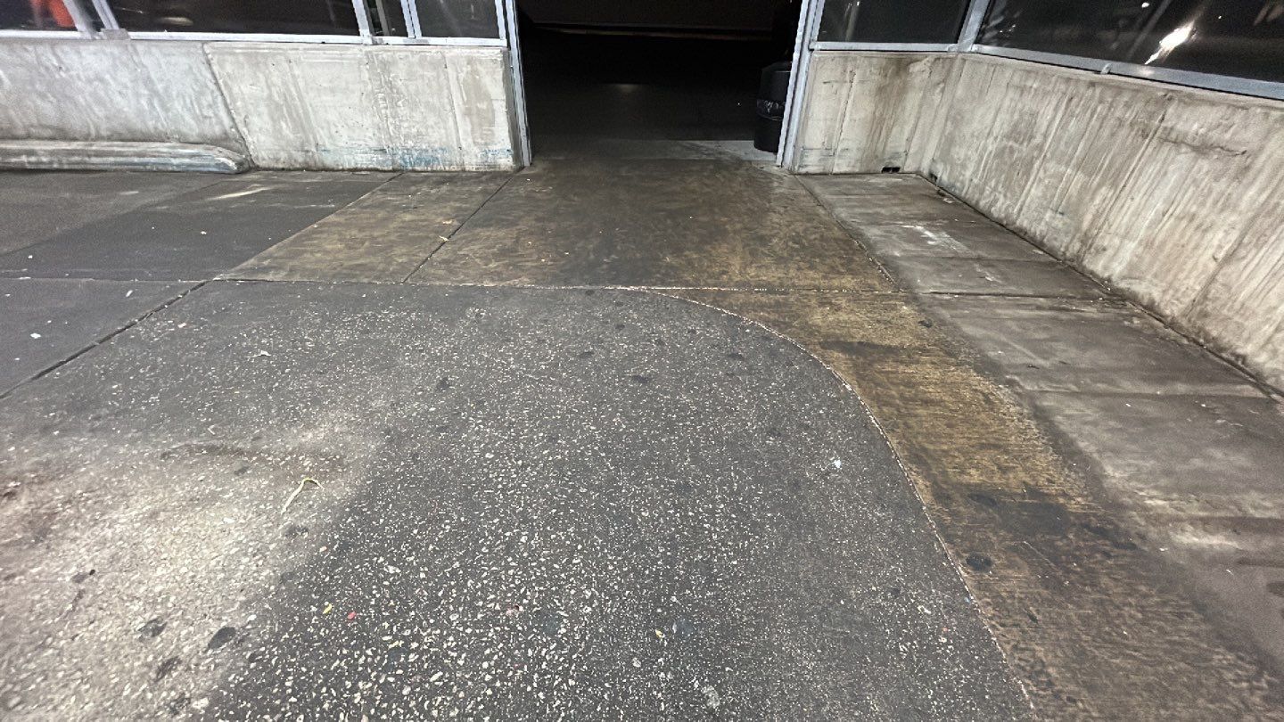 Concrete sidewalk cleaning and degreasing by Northern Power Washing LLC.