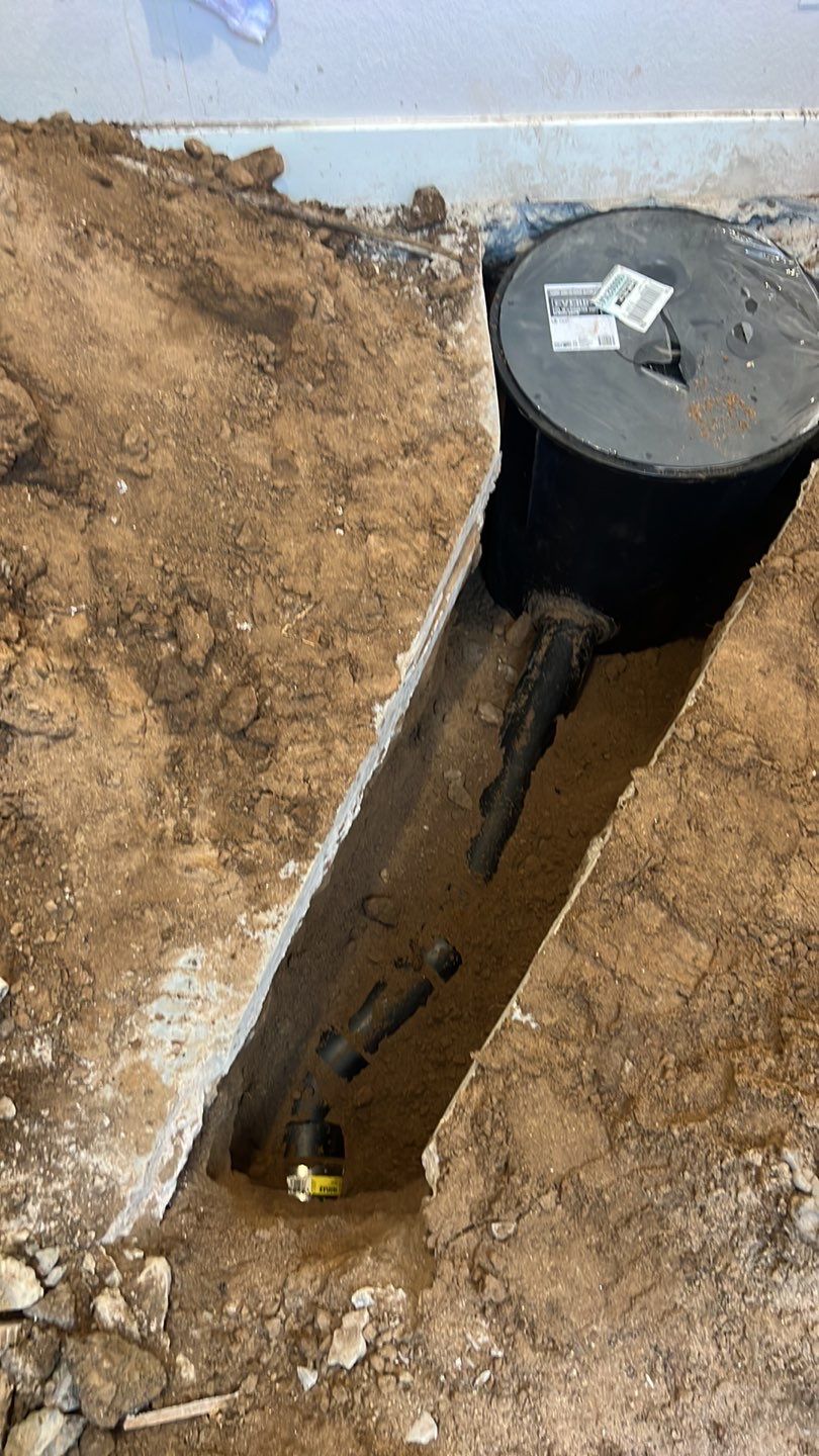 Basement Sump pump/pit by Plumbing Connect Systems LLC