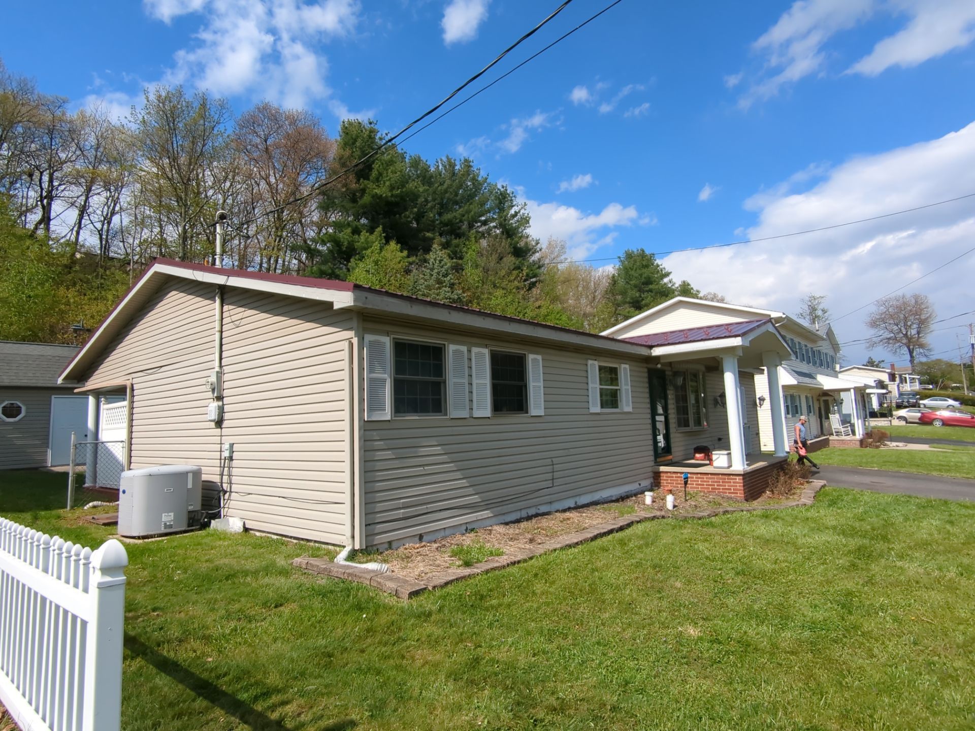 Maroon ABM Metal Roof Replacement and Gutter Installation in Shenandoah by Esh Builders