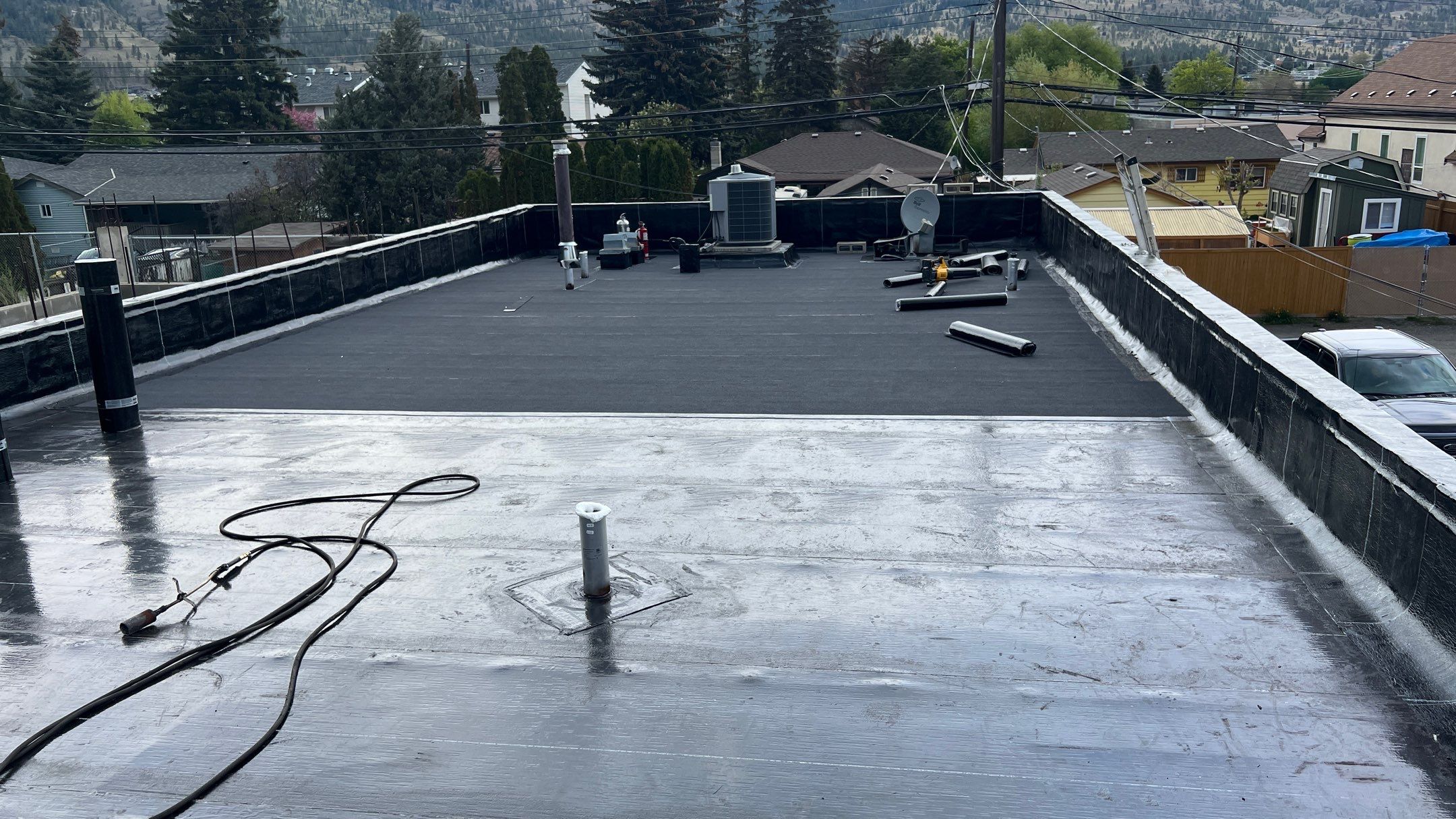 Commercial ReRoofing Installation using IKO 2ply sbs by Top Notch Roofing Inc