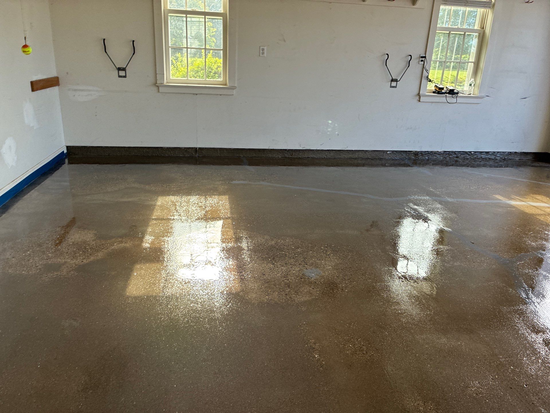Basalt Concrete Floor Coating Transformation by DiGiorgi Roofing and Siding Inc