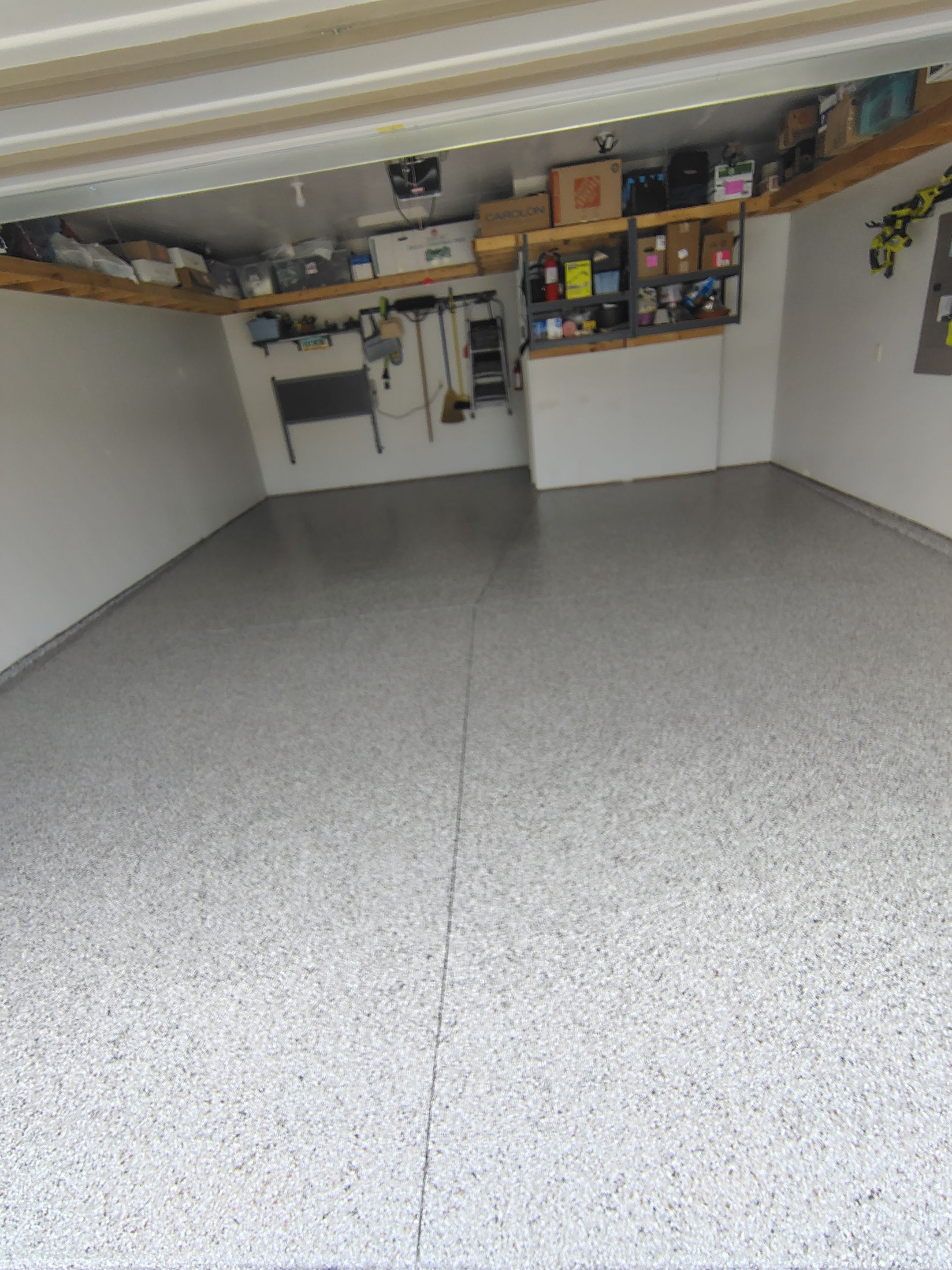 Decorative Chip Garage Concrete Coating Installation in Sioux Falls by Select Painting, Coatings & Garage Cabinets