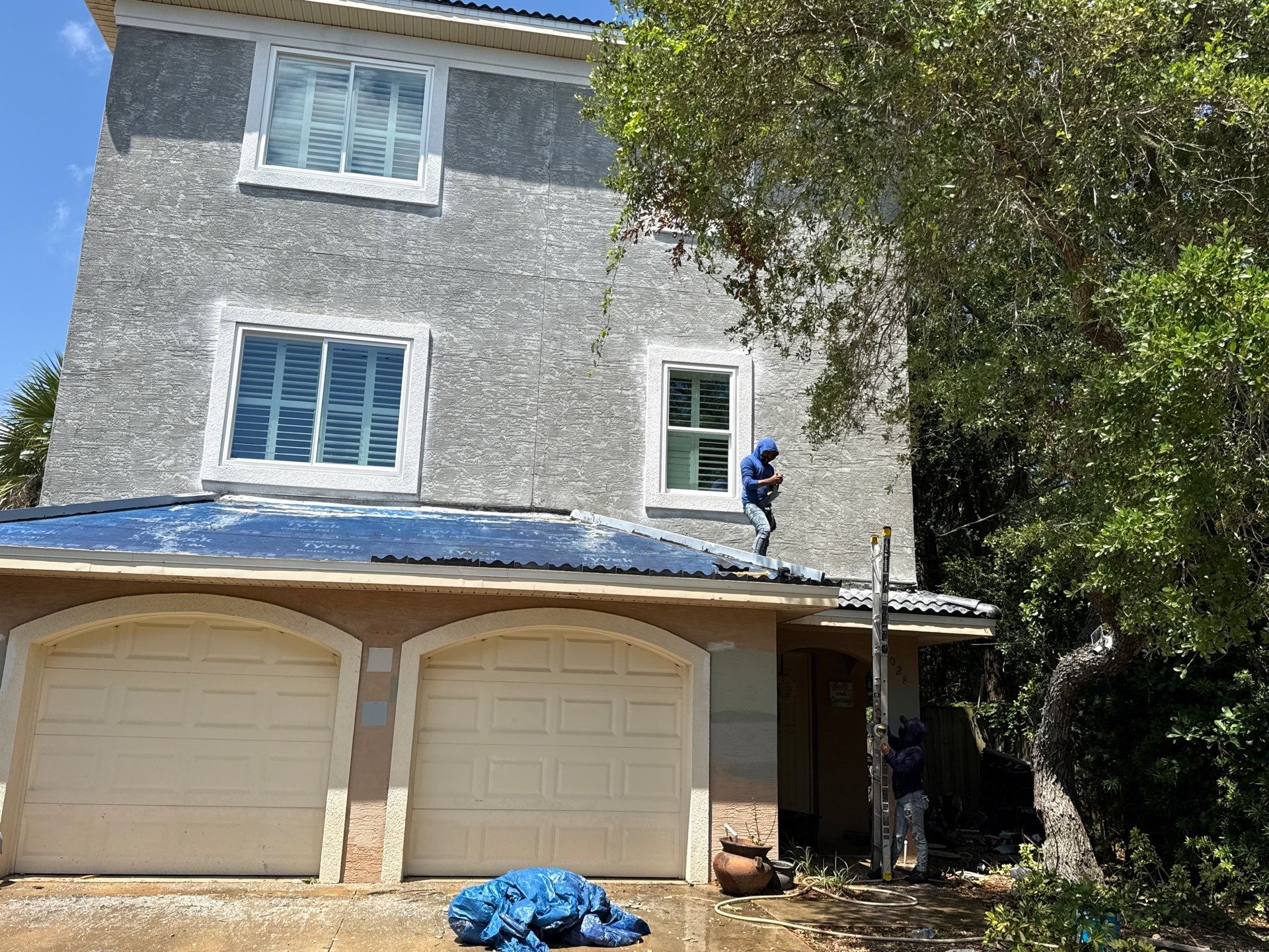 Flagler Beach Residential Tile Roof Replacement with Dark Barrel Tiles by Fortified Roofing Solutions Corp.