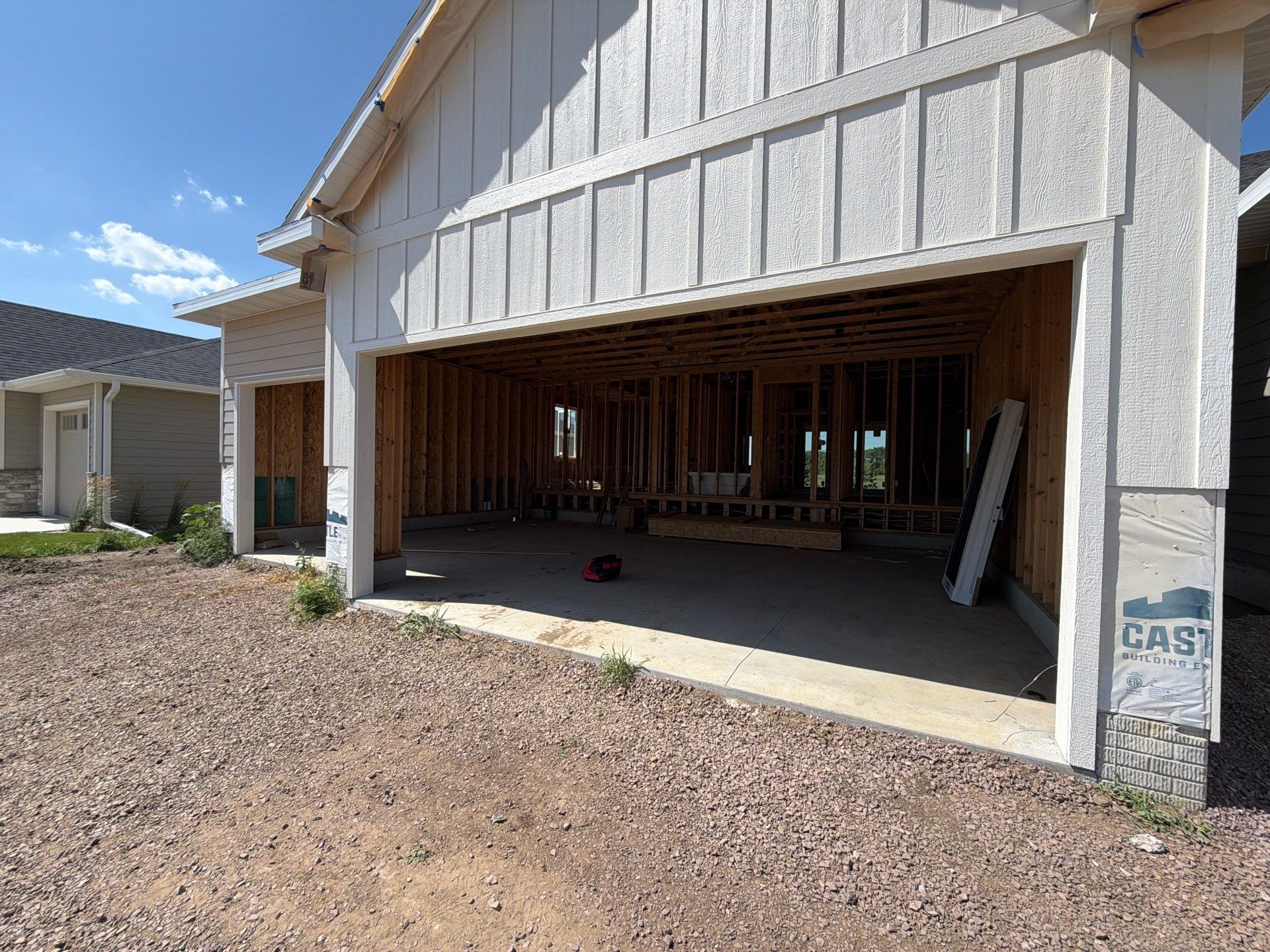 Grey Speckled Garage Floor Coating in Sioux Falls by Select Painting, Coatings & Garage Cabinets