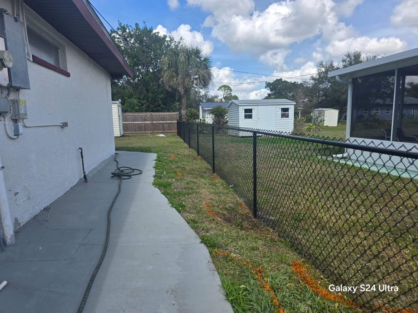 Black Chain Link Fence Installation for Port Charlotte Residence by True Fence LLC