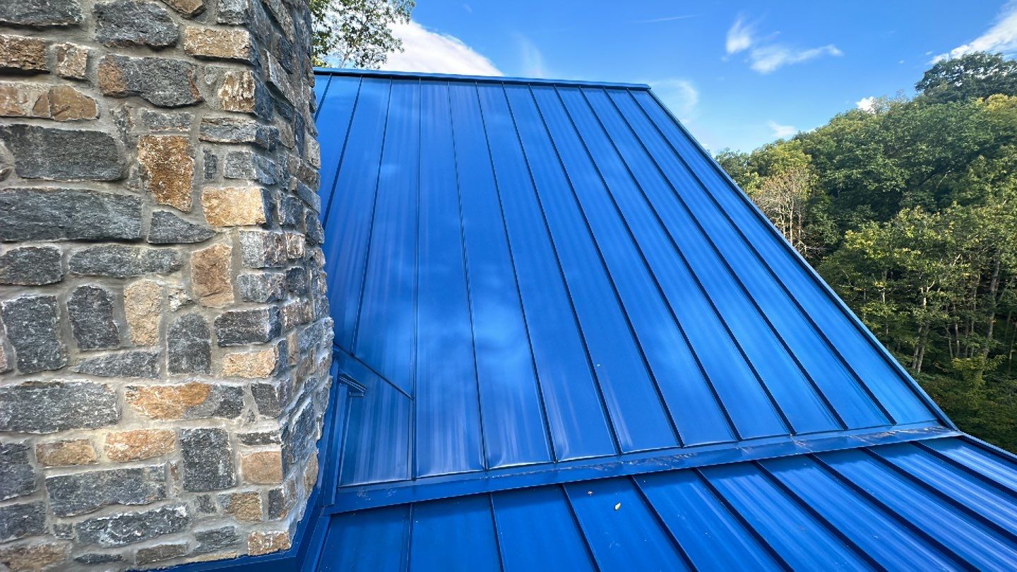 Residential Roofing Installation using Standing Seam Metal - Gallery Blue by RoofX 