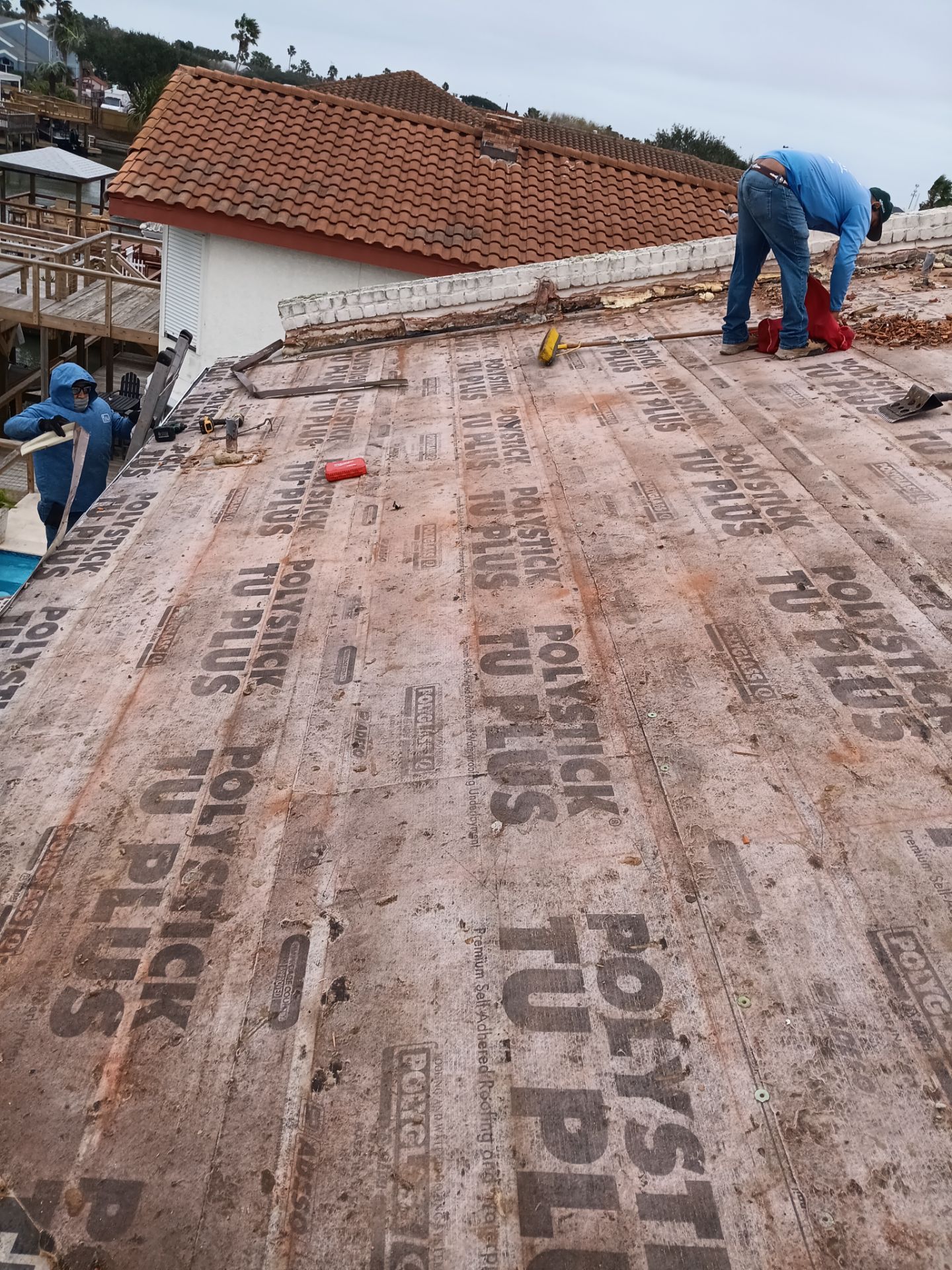 Off with the Tile and on with the TILCOR stone coated metal.  by Bayfront Roofing and Construction
