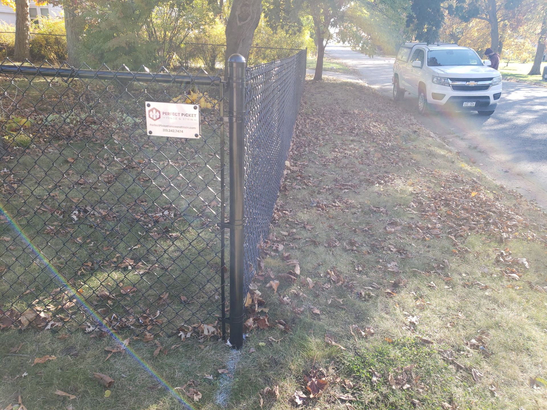 Black Chain Link Fence Installation in Cedar Falls, Iowa by Perfect Picket Fence and Stain